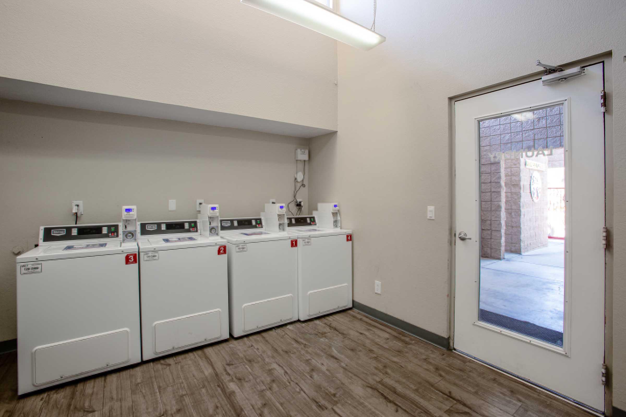 a kitchen with a building in the background