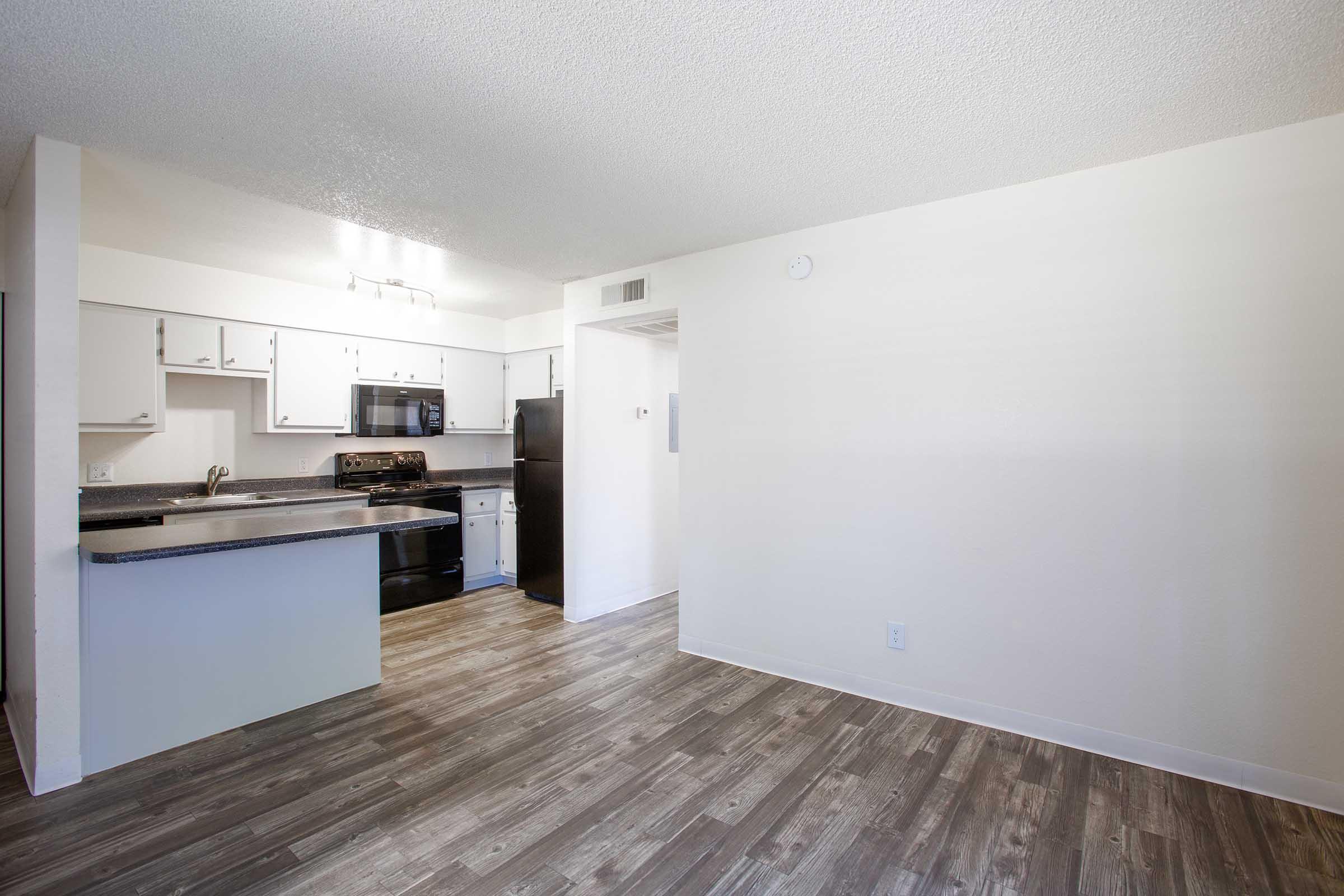 a kitchen with a wood floor