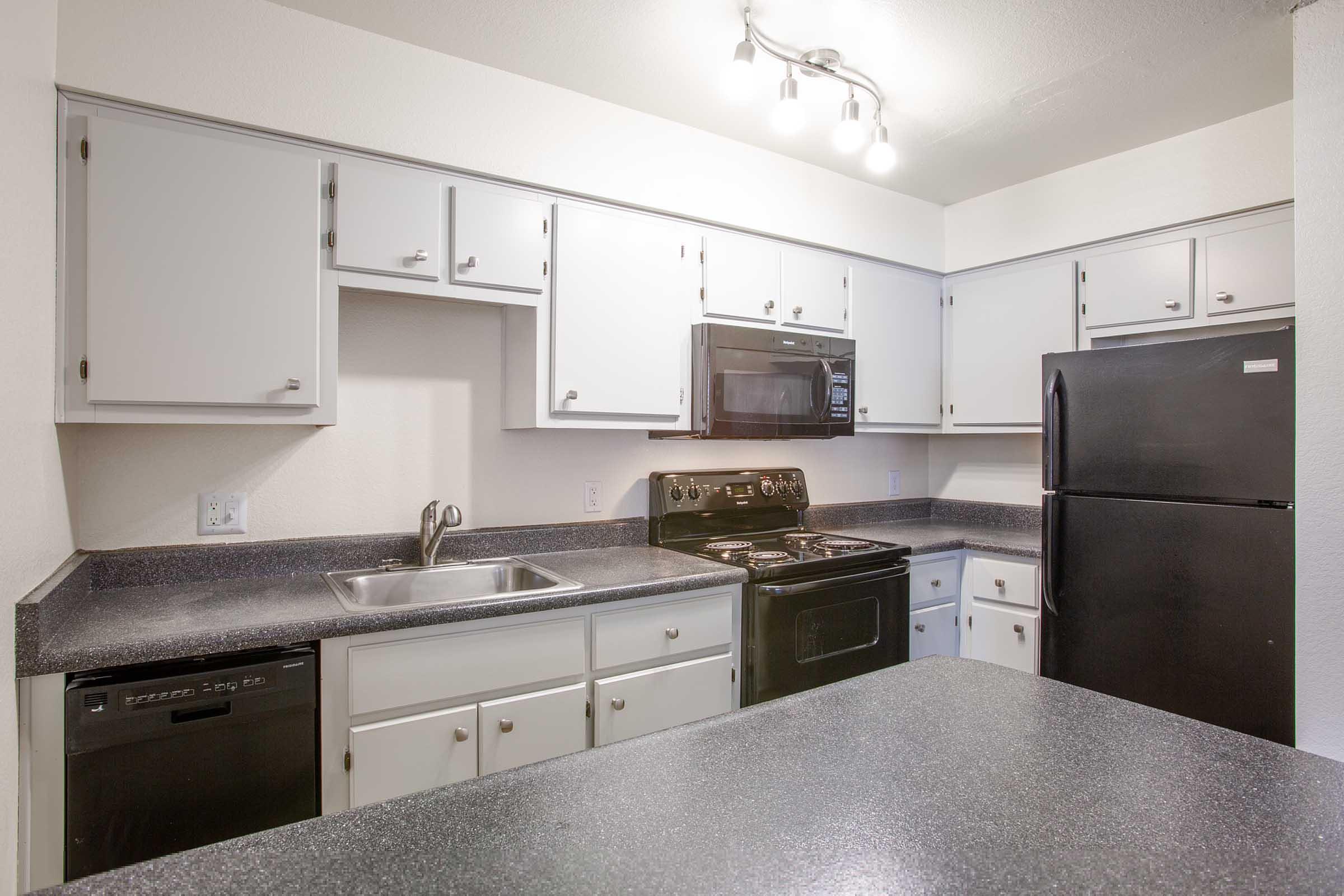 a large kitchen with stainless steel appliances