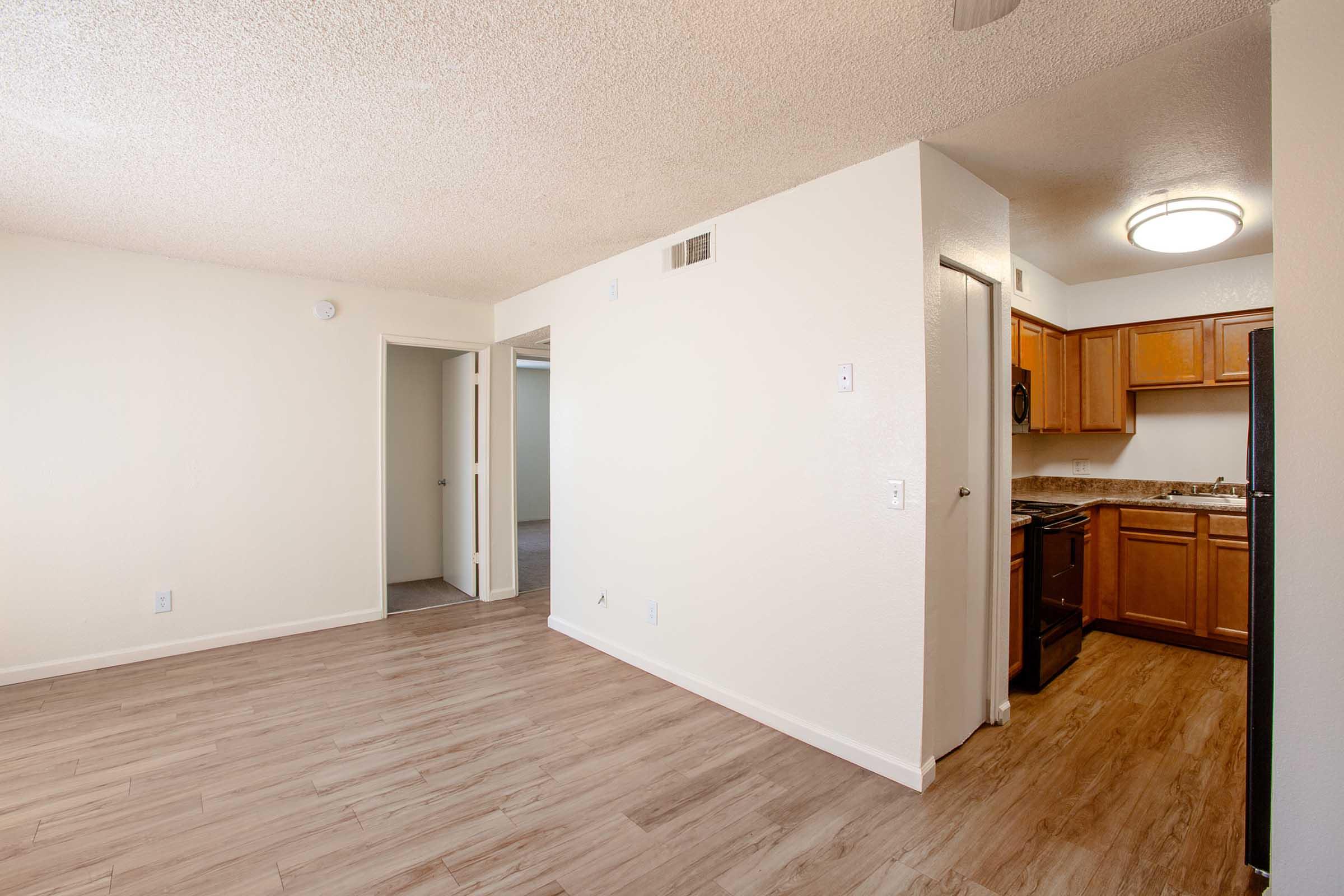 a kitchen with a wood floor