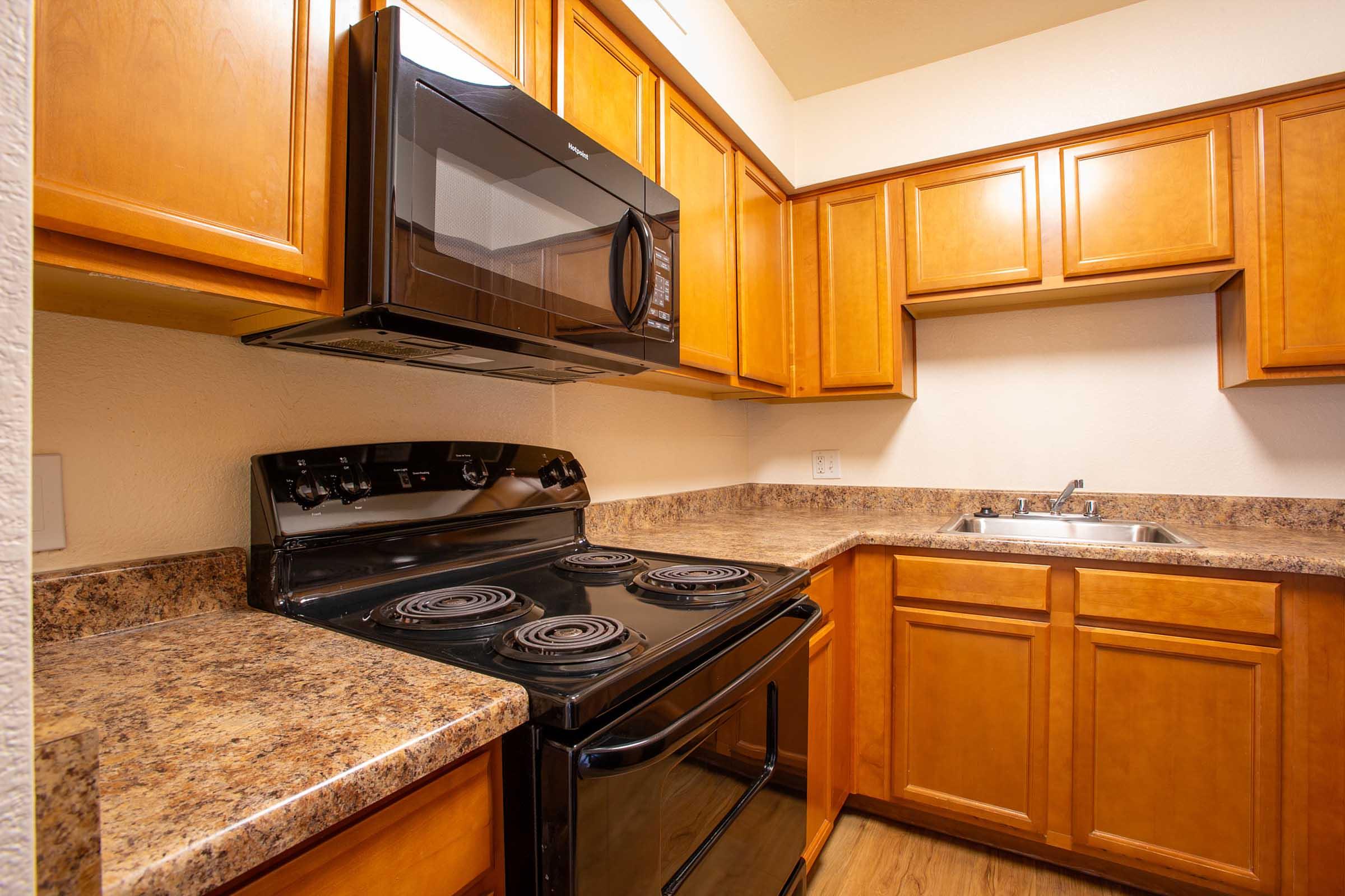 a kitchen with a stove top oven