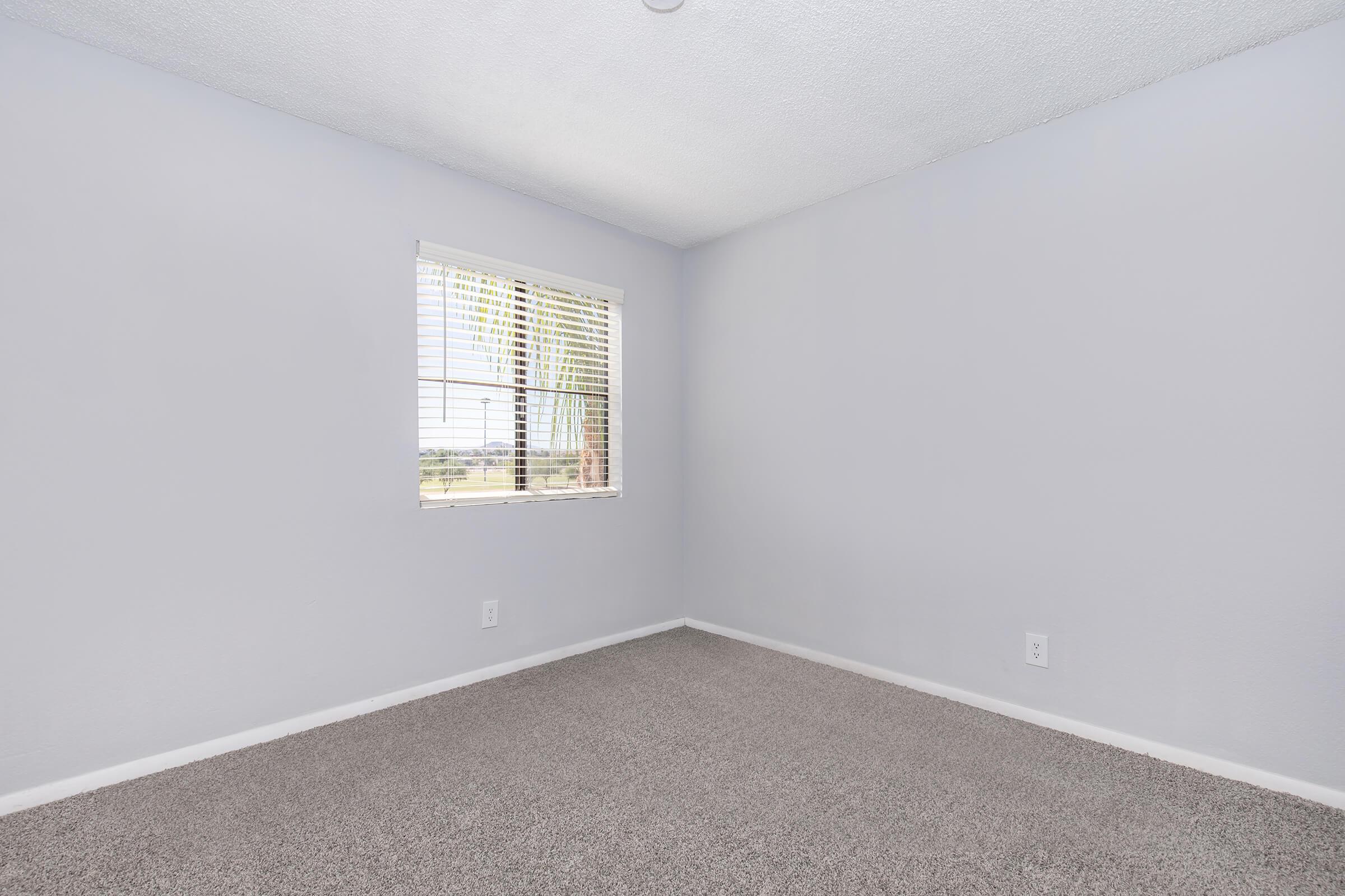 a bedroom with a large mirror