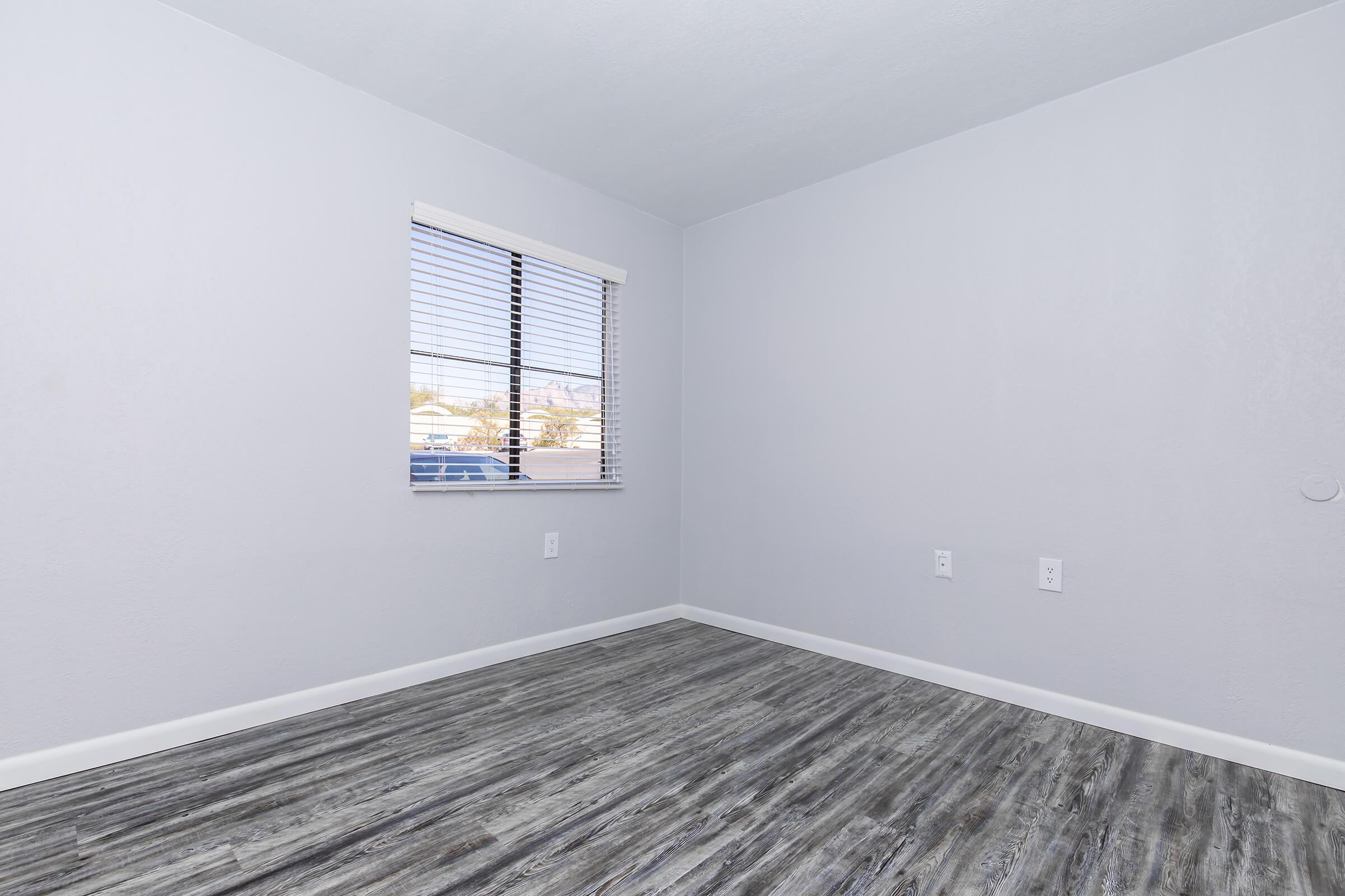 a bedroom with a large window