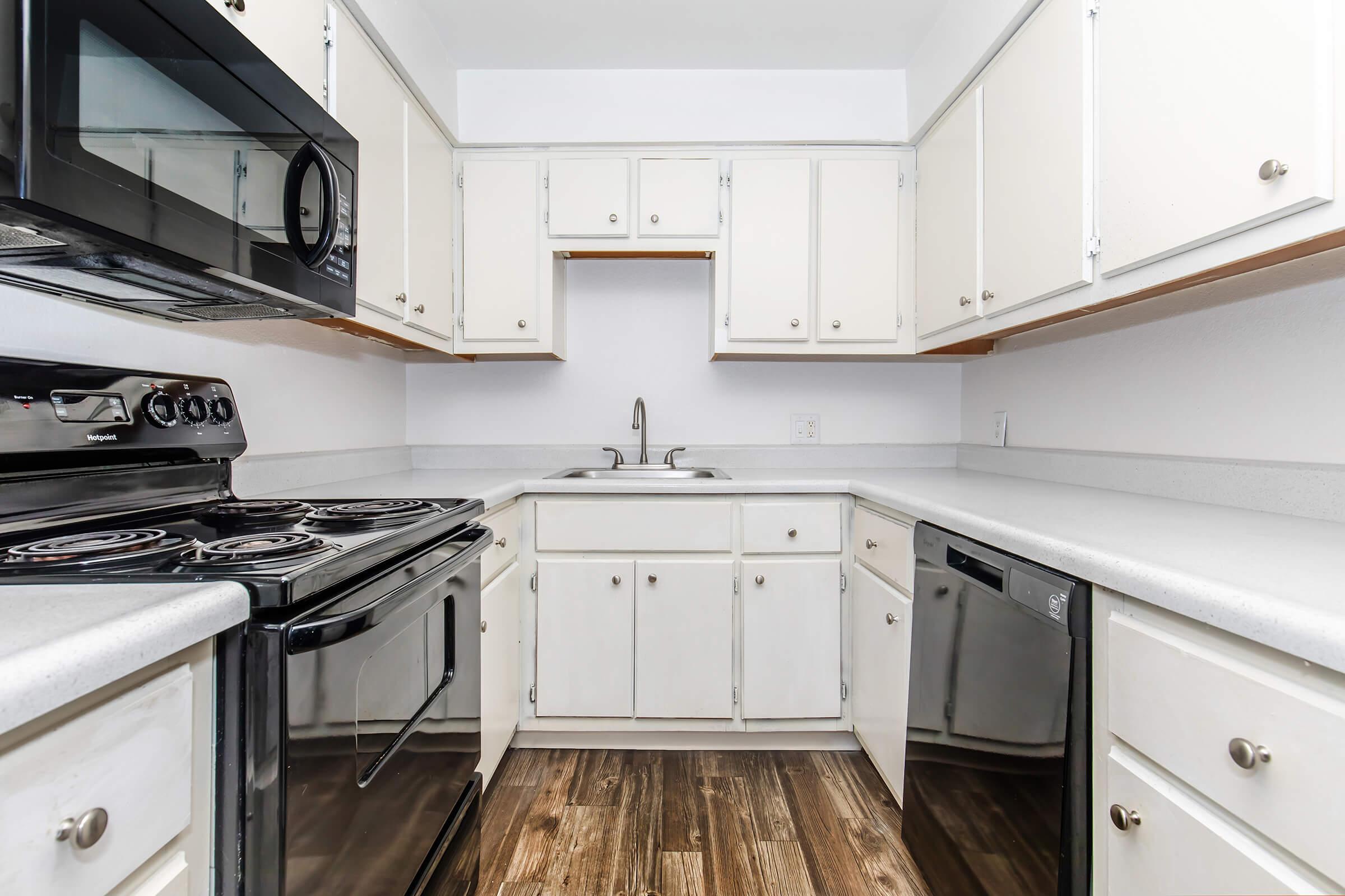 a kitchen with a stove top oven