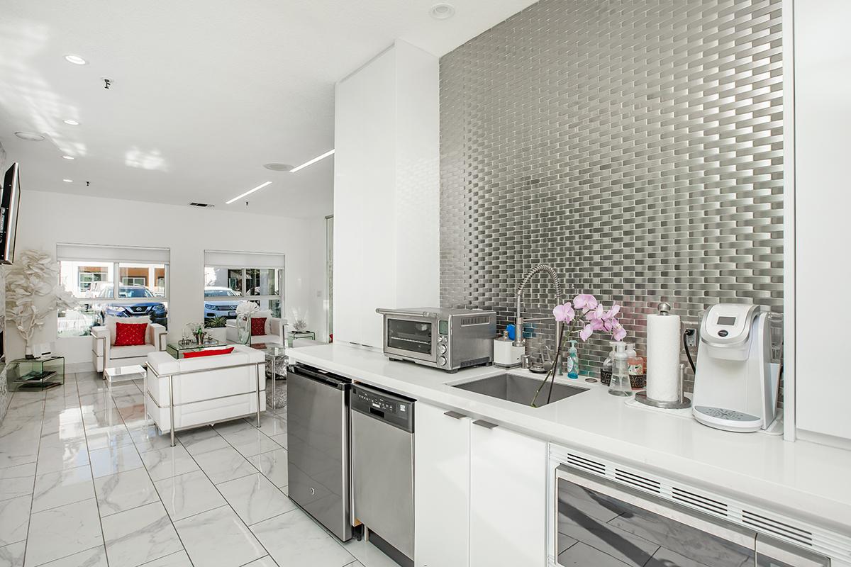 a kitchen with a sink and a microwave