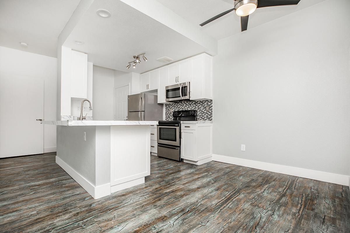 a kitchen with a wooden floor