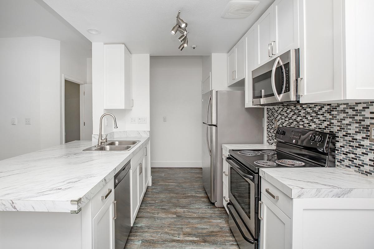 a kitchen with a stove and a sink