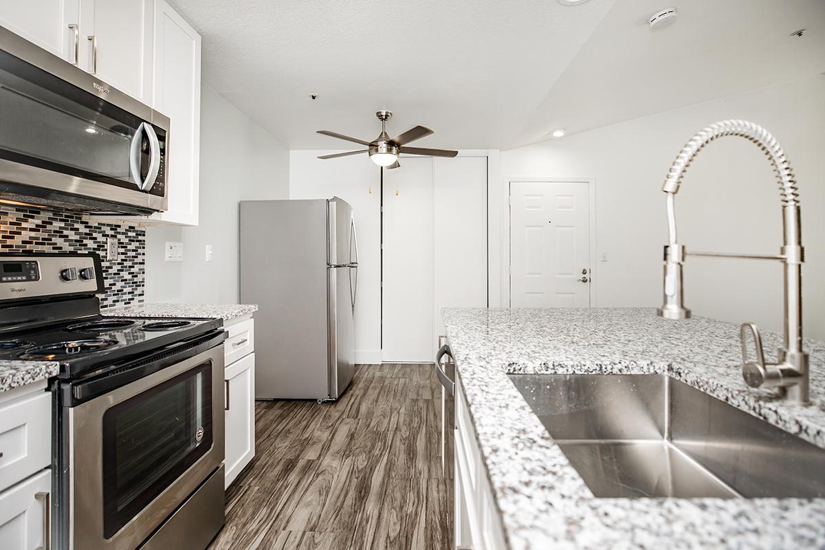 a kitchen with a stove top oven