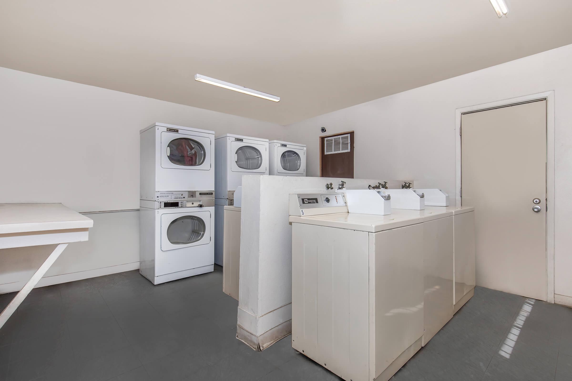 a kitchen with a refrigerator and a microwave