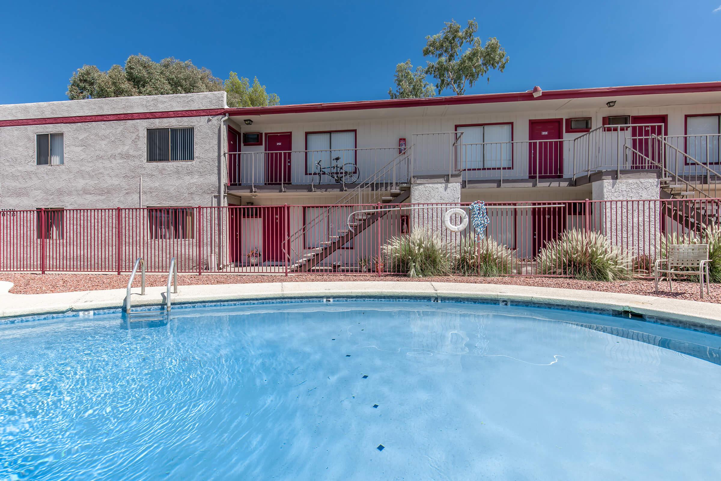 a pool of water in front of a house