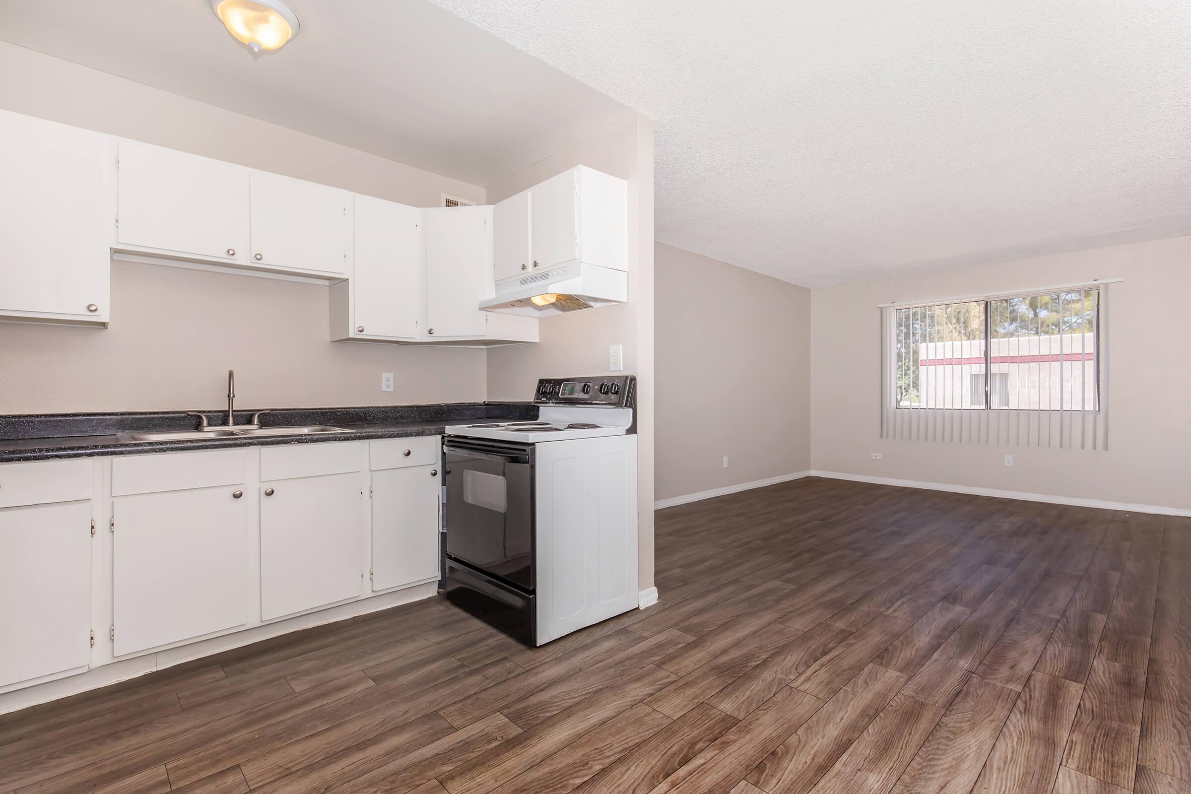 a kitchen with a wood floor