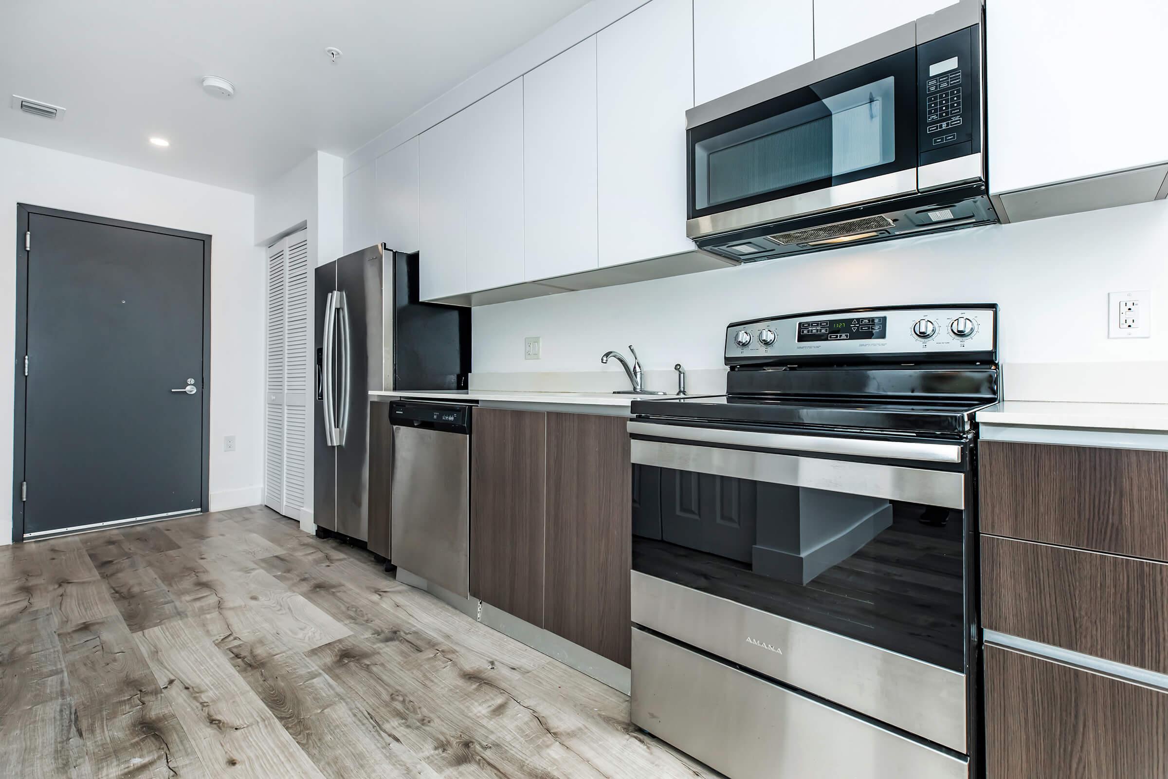 a kitchen with a stove top oven