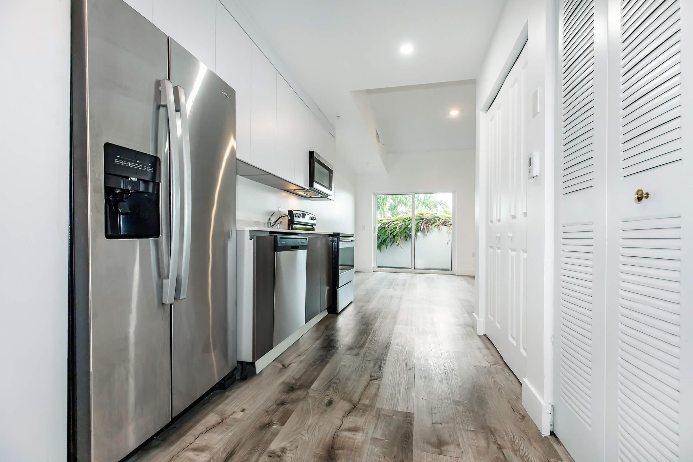 a stainless steel refrigerator in a room