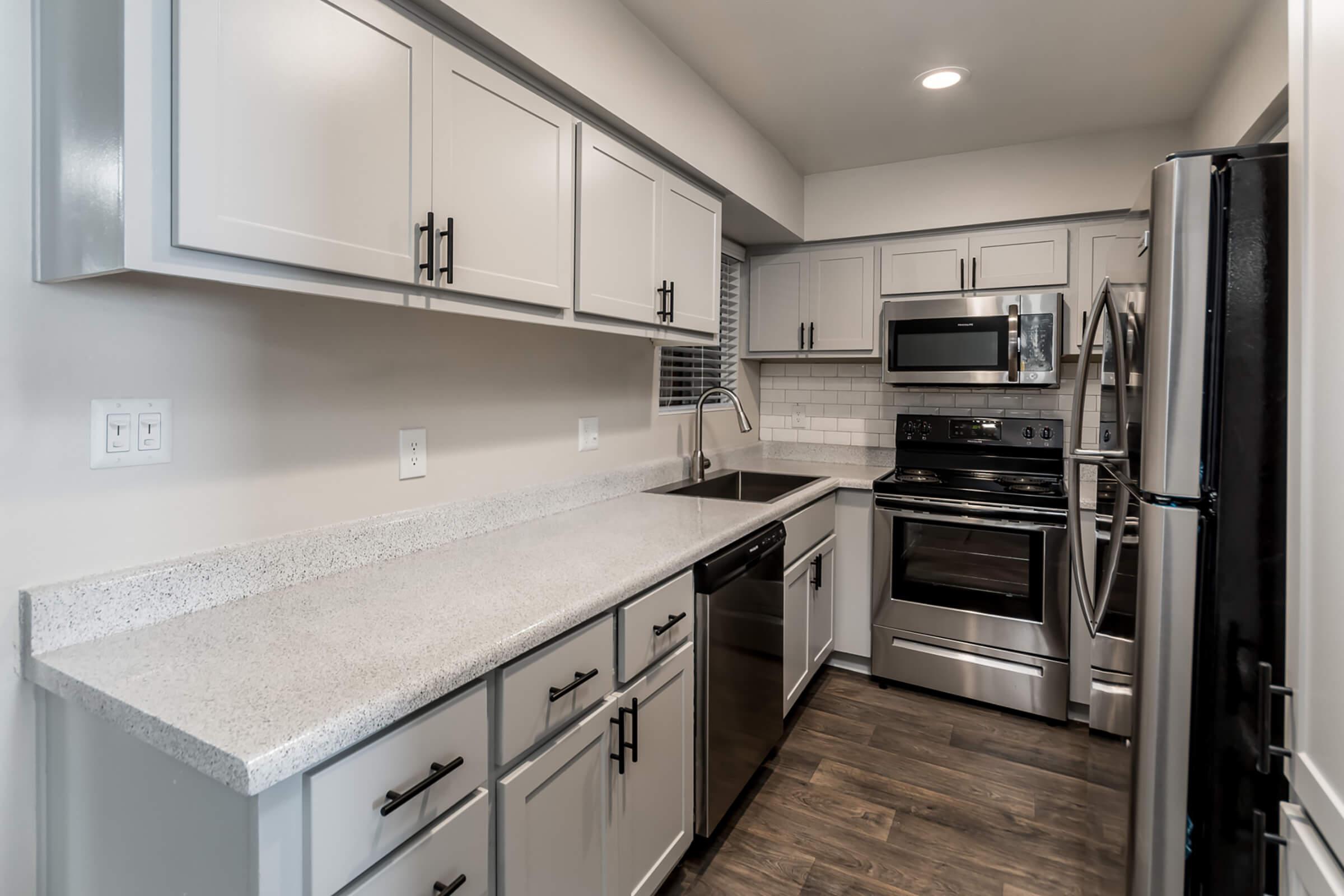 Updated and Furnished Kitchen - Glenridge Apartments - Glendale - Arizona