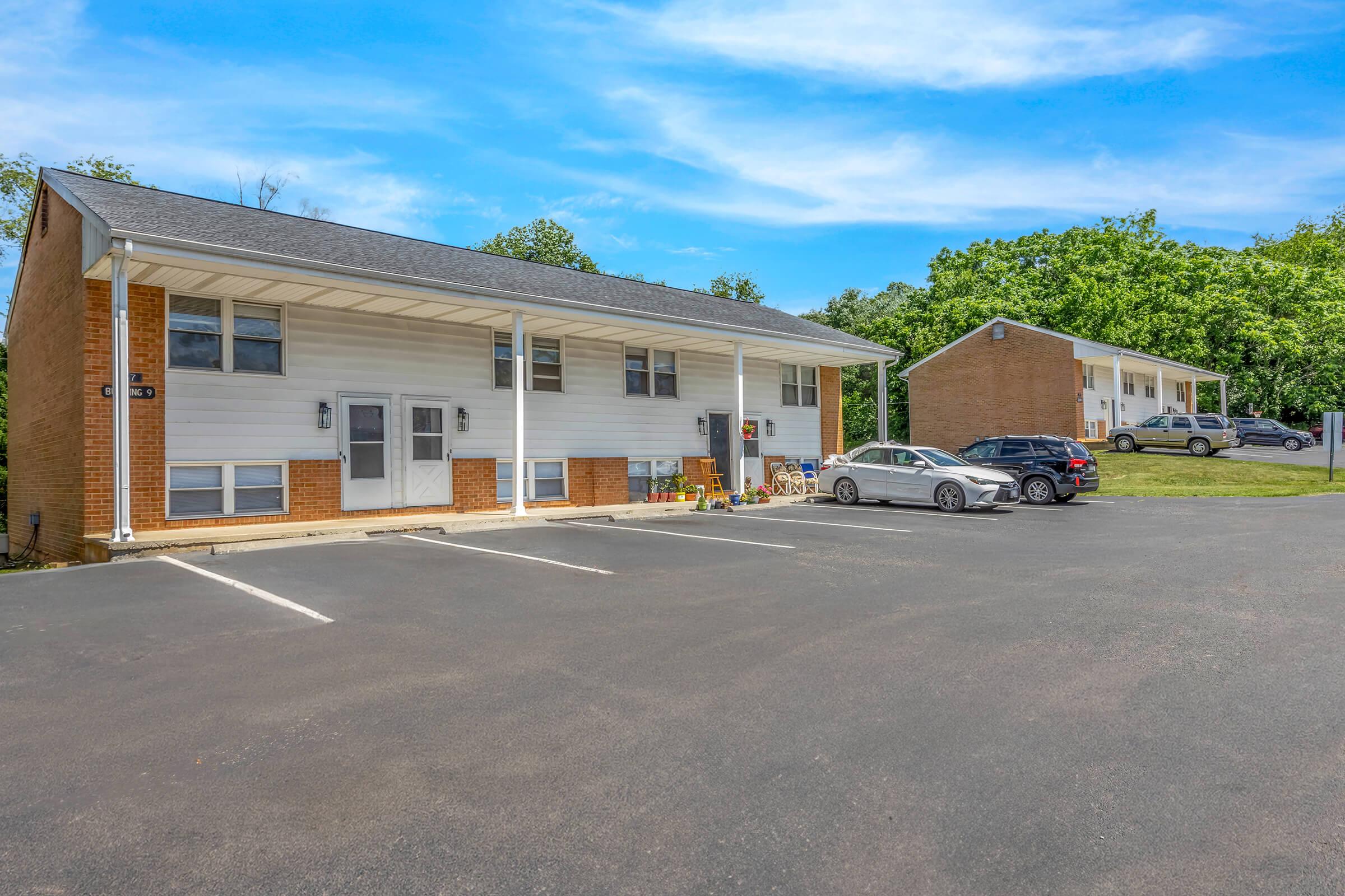 a small house in a parking lot