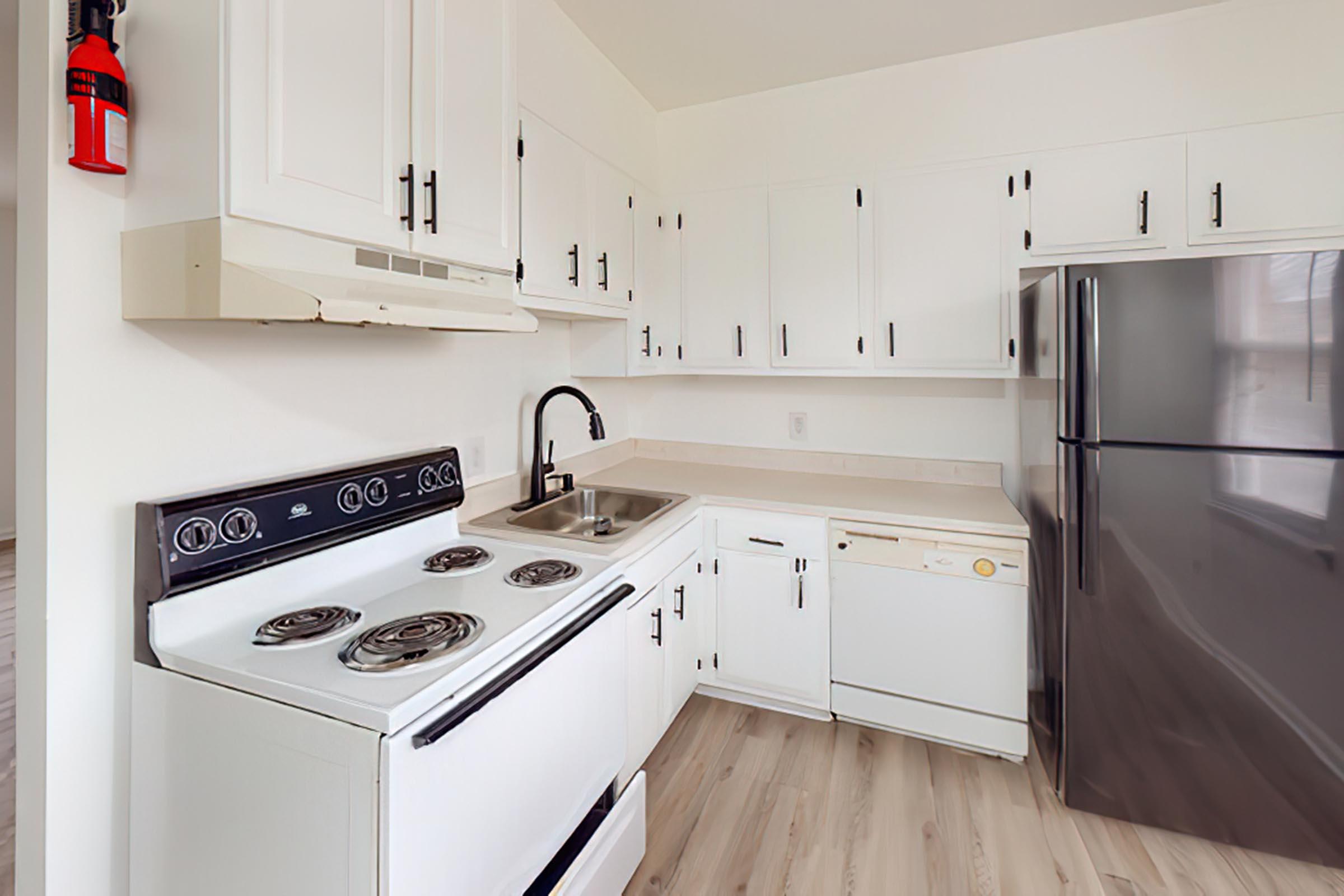 a kitchen with a stove top oven sitting inside of a refrigerator