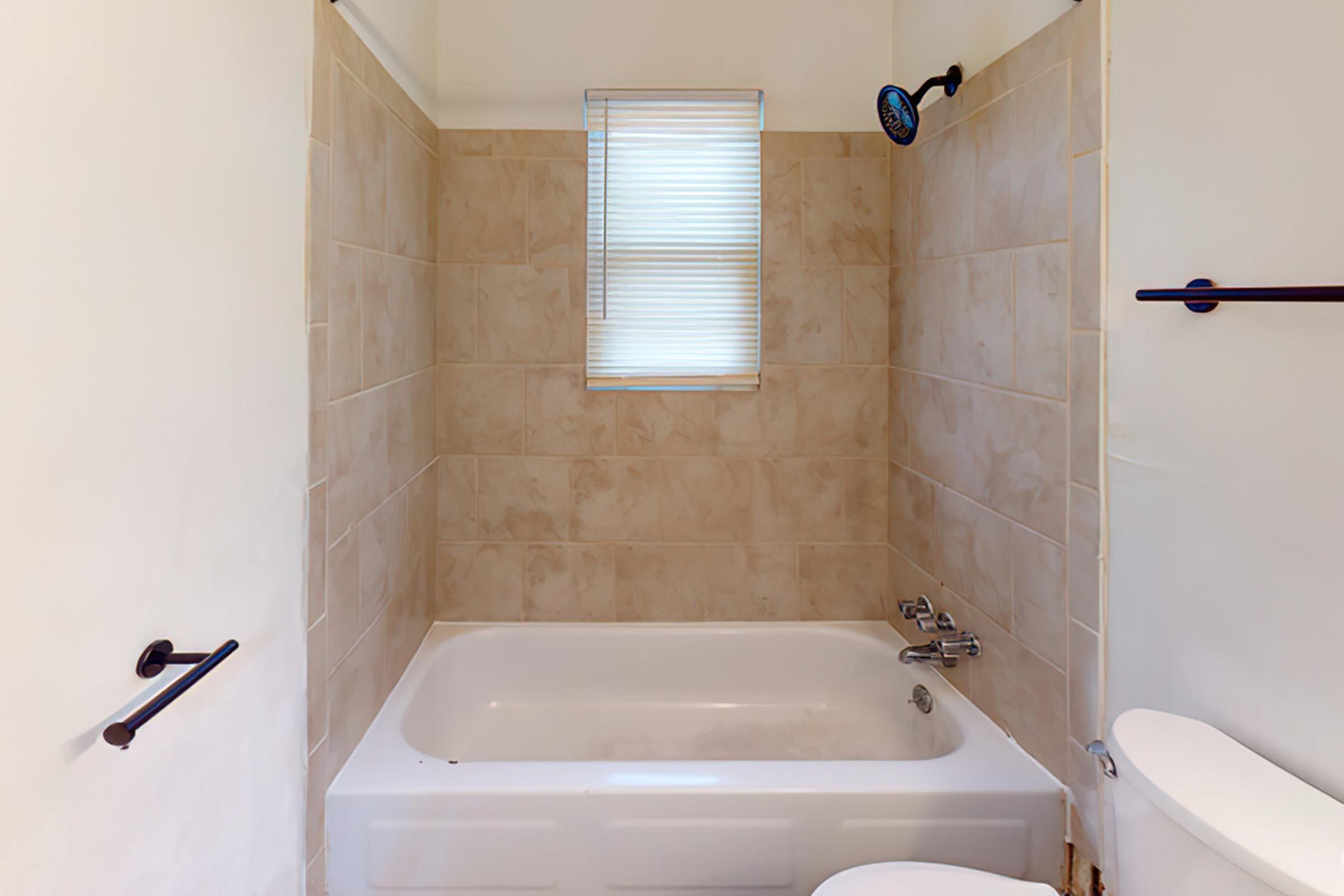 a close up of a sink and a bath tub