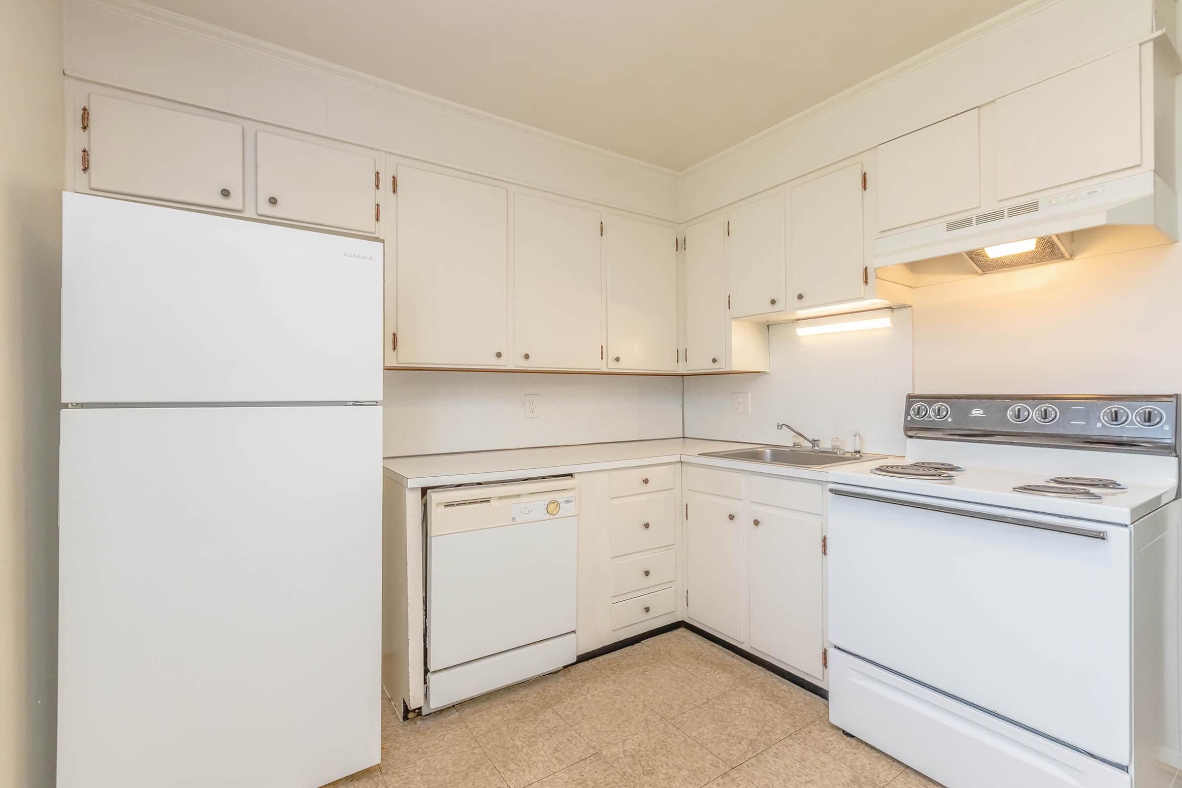 a kitchen with a stove top oven sitting inside of a refrigerator