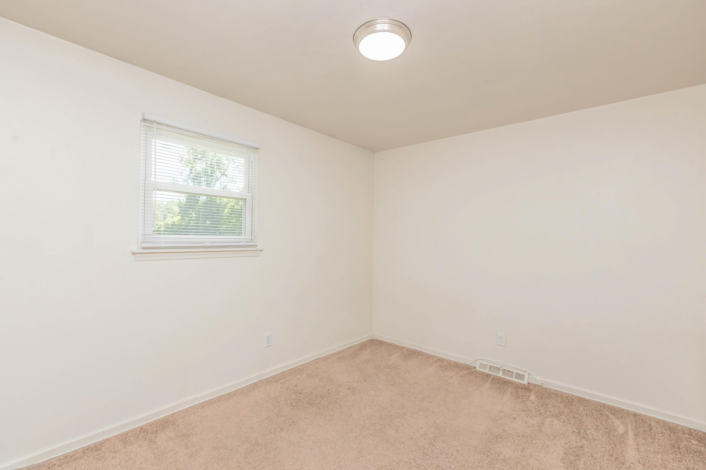 a room with a sink and a window