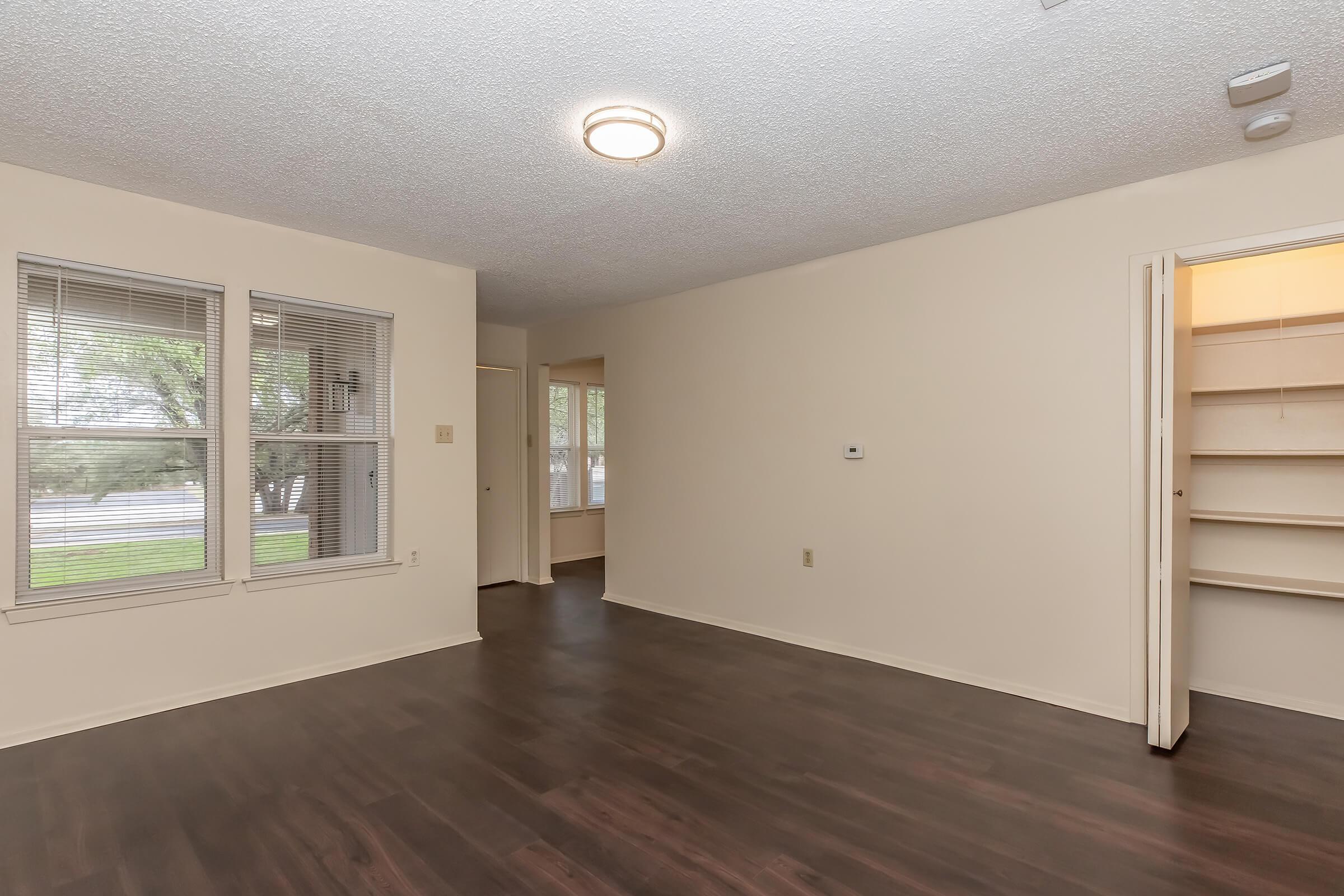 a room filled with furniture and a large window