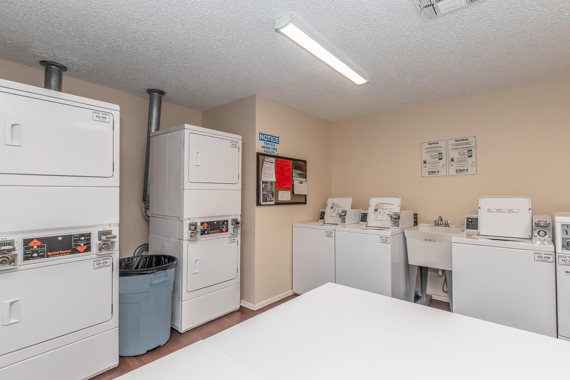 a kitchen with a stove and a refrigerator