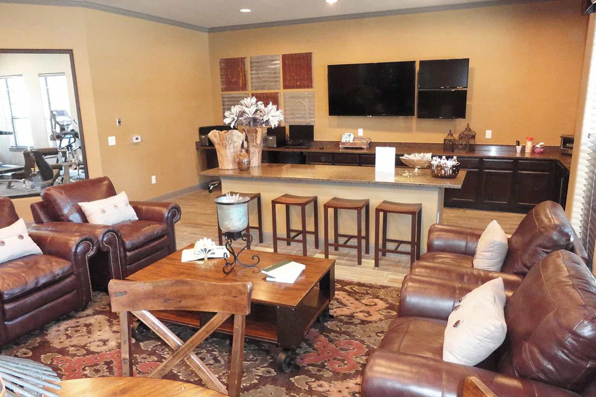 a living room filled with furniture and a fire place