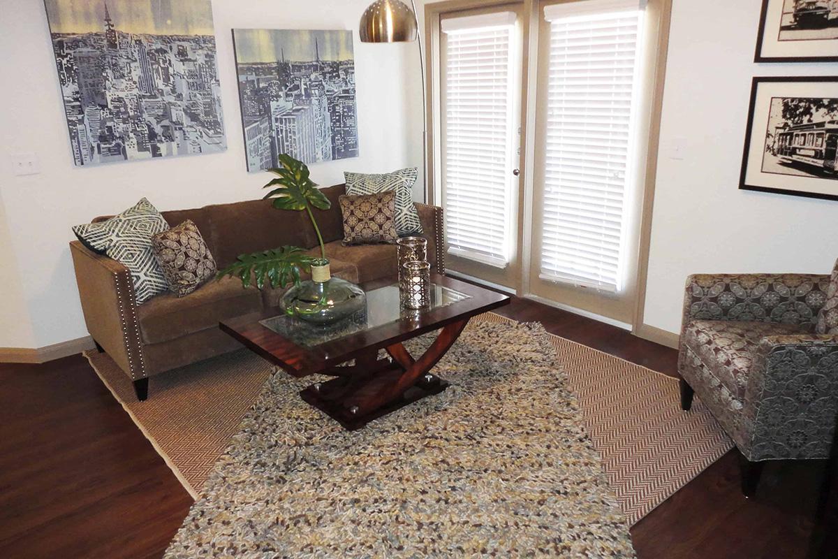 a living room filled with furniture and a window
