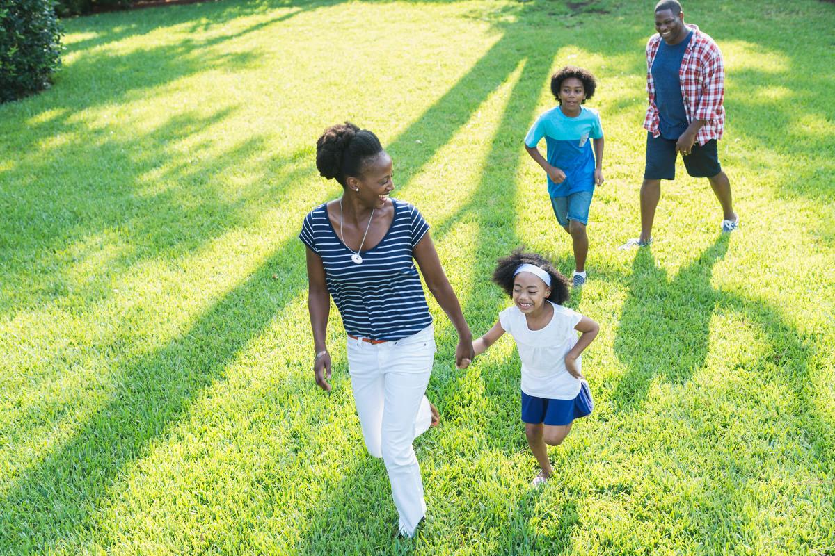 Family with mixed race children outdoor playing, walking iStock-541134950.jpg