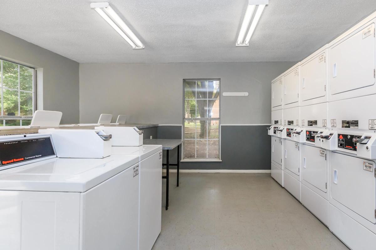 a large kitchen with white cabinets