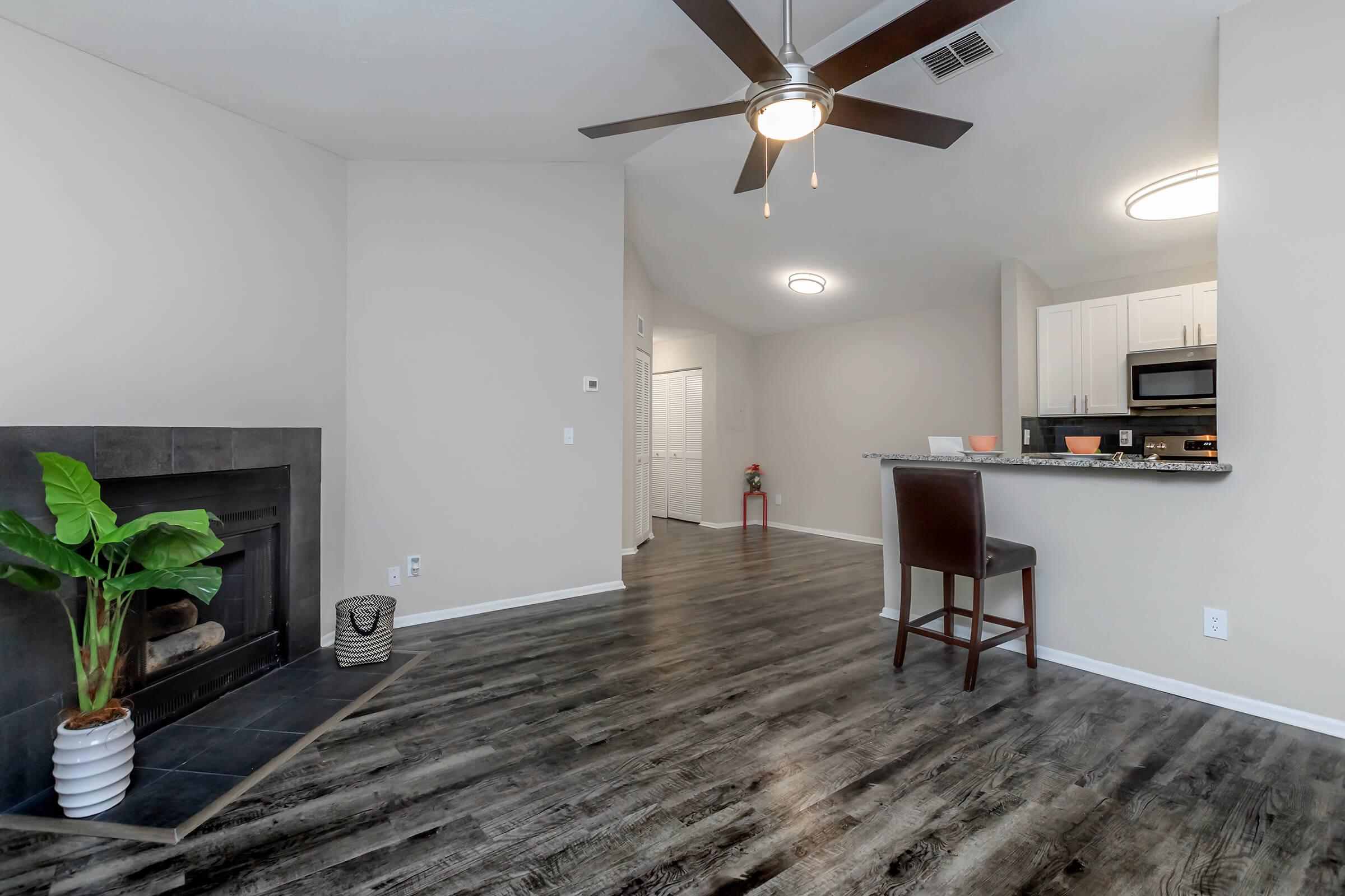 a living room filled with furniture and a flat screen tv