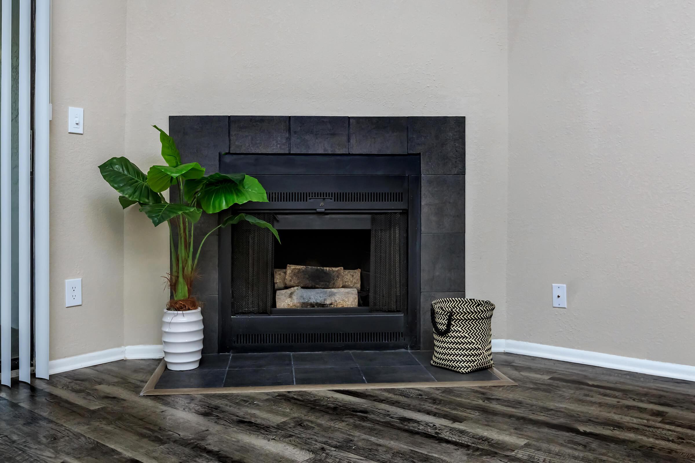 a close up of a fire place sitting in a room