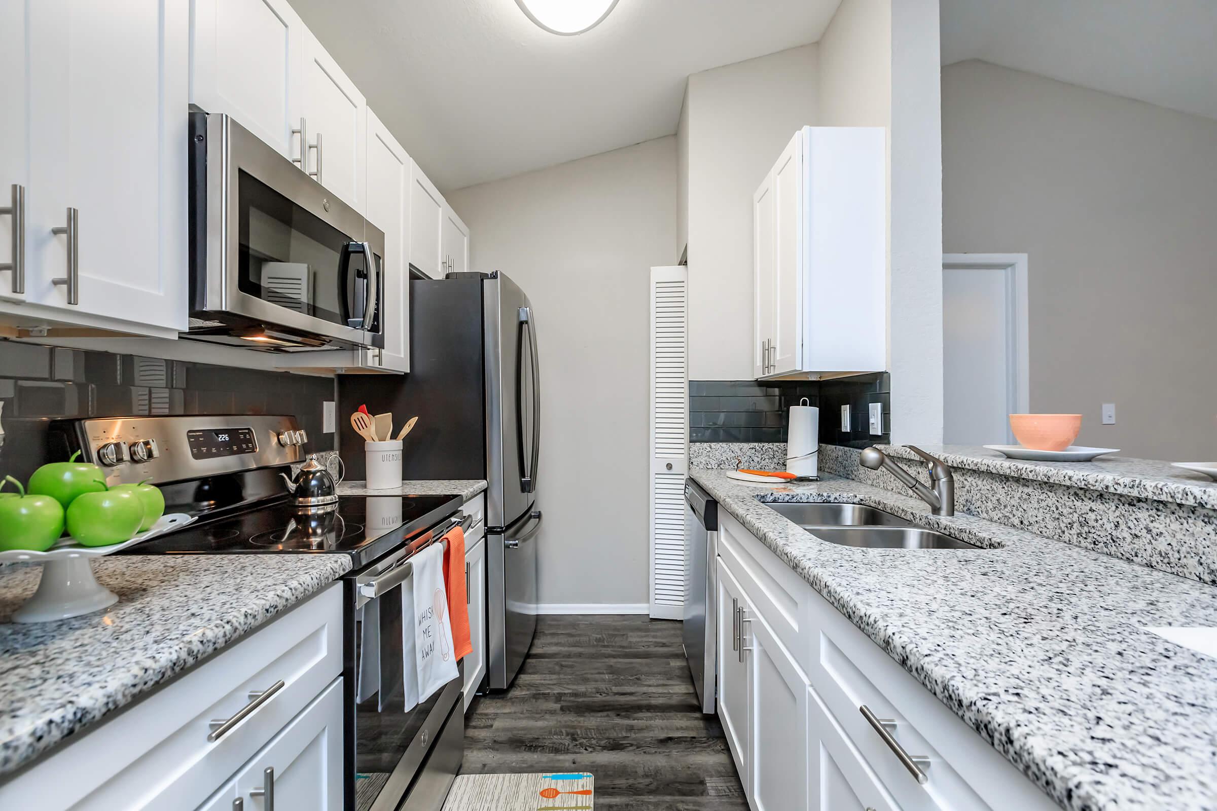 a modern kitchen with stainless steel appliances