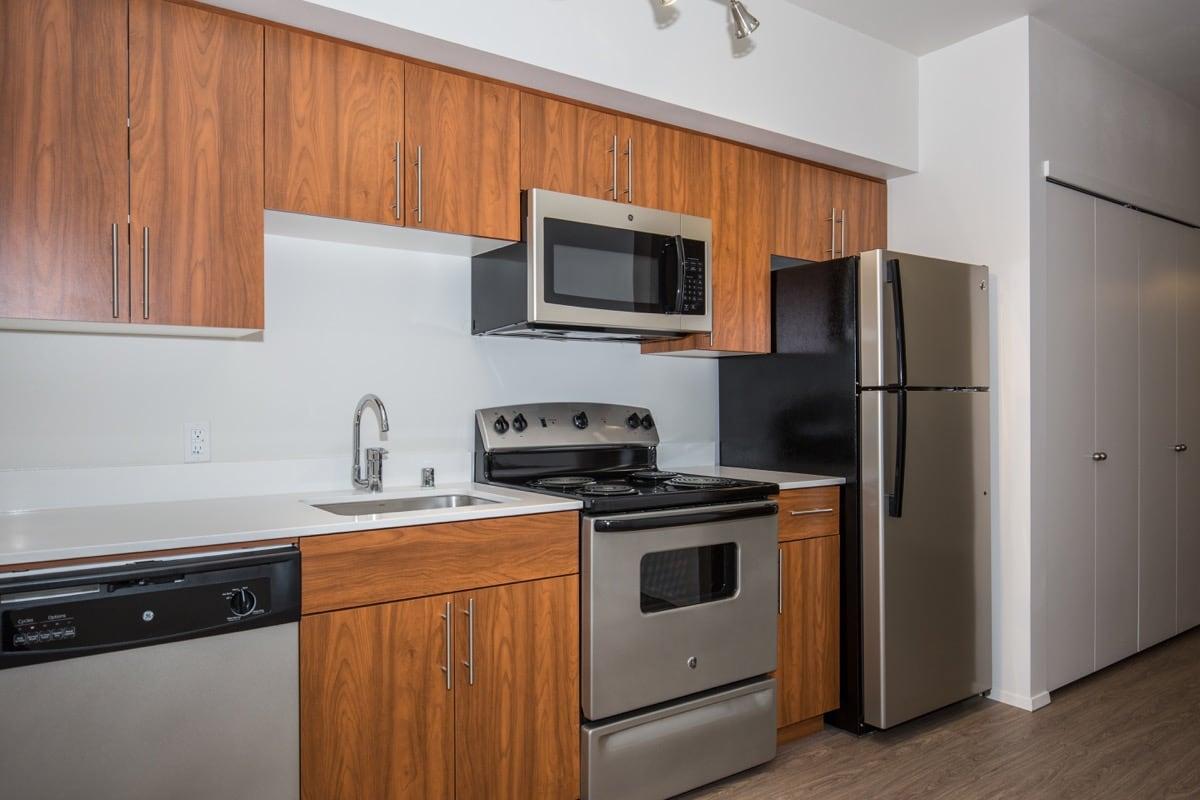 a kitchen with a stove top oven sitting inside of a refrigerator