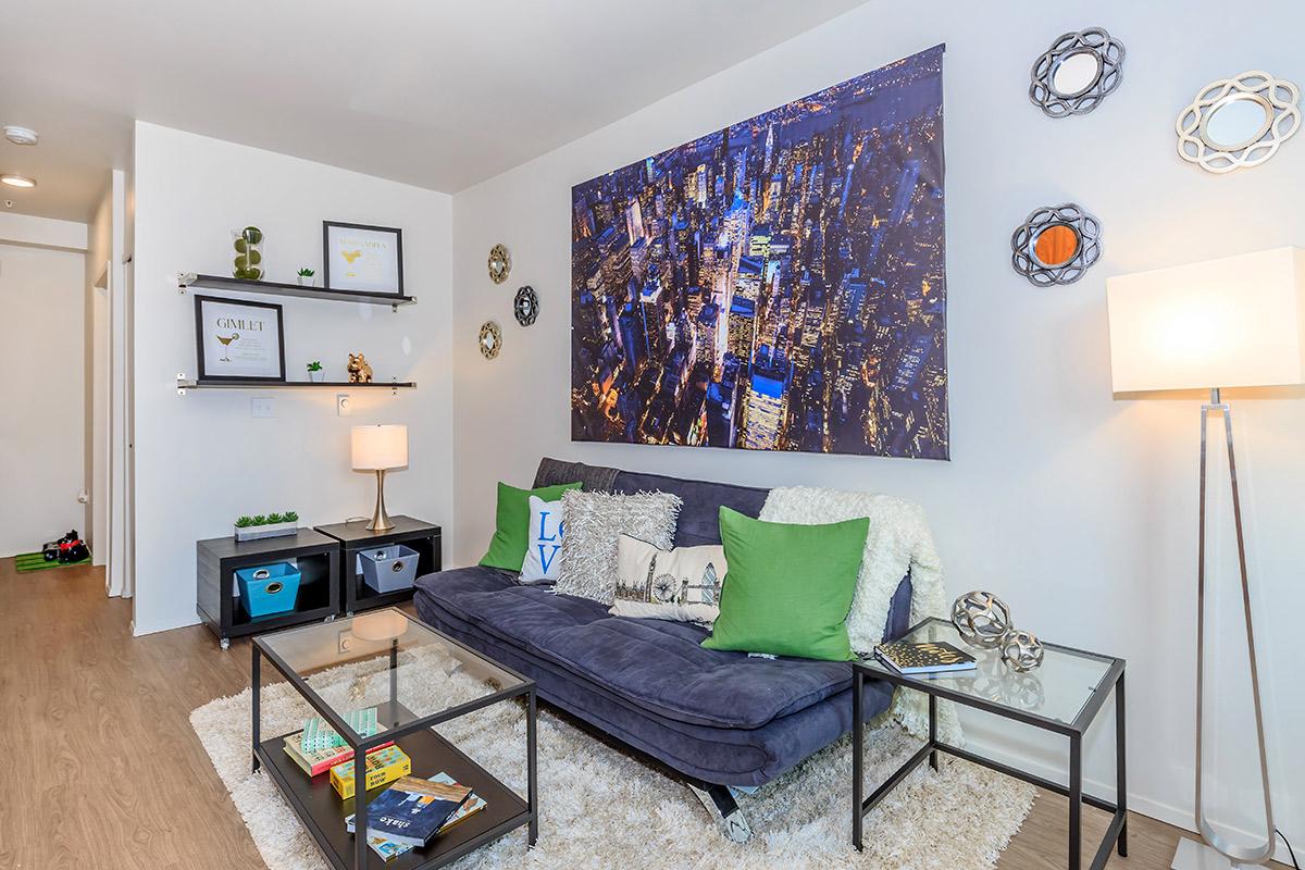 a living room filled with furniture and a flat screen tv
