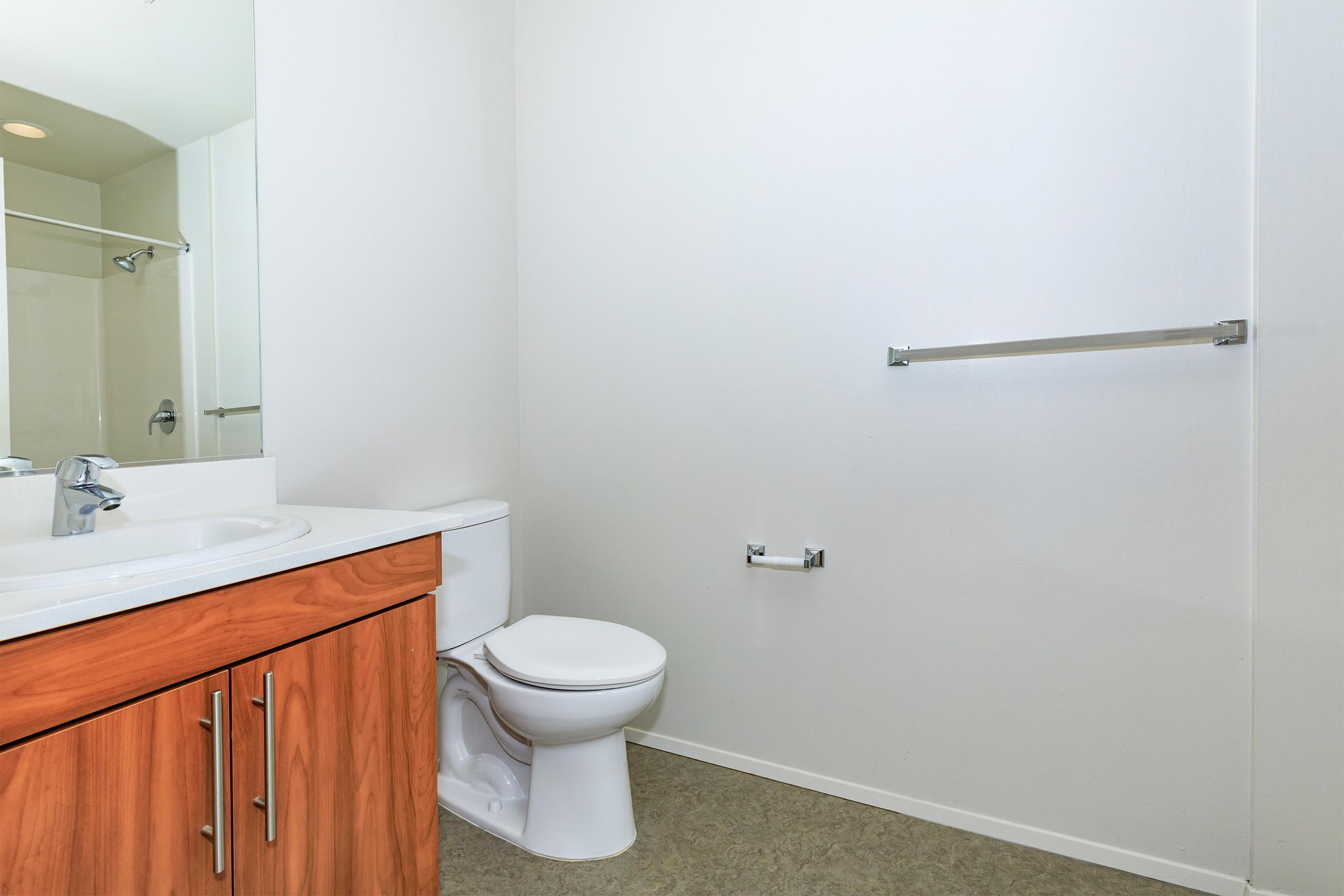 a room with a sink and a mirror