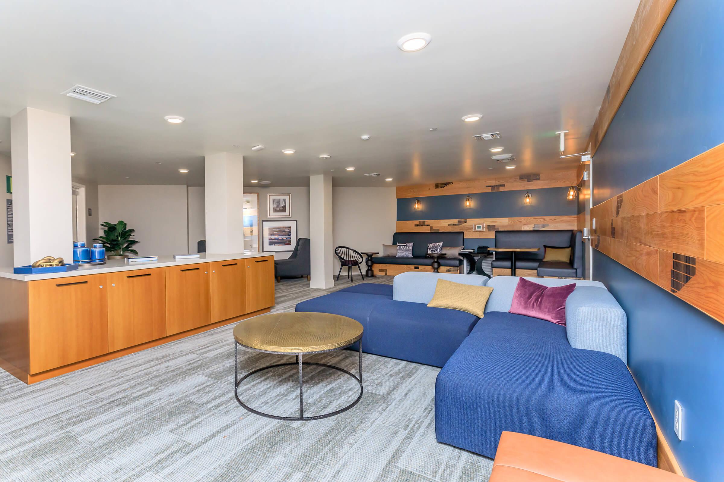 a bedroom with a bed and a chair in a room