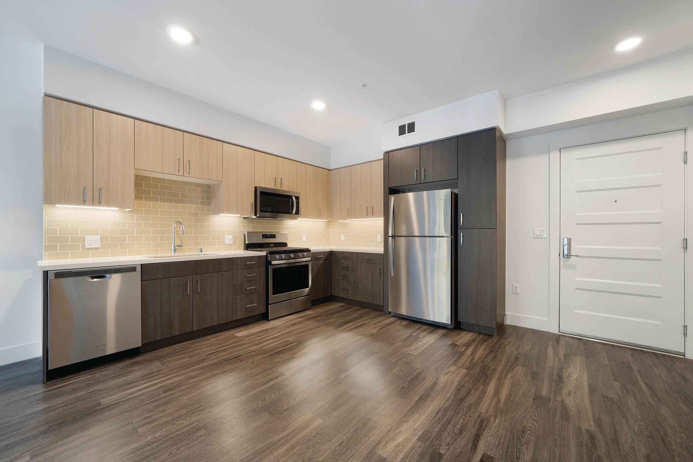 Vacant kitchen with stainless steel appliances