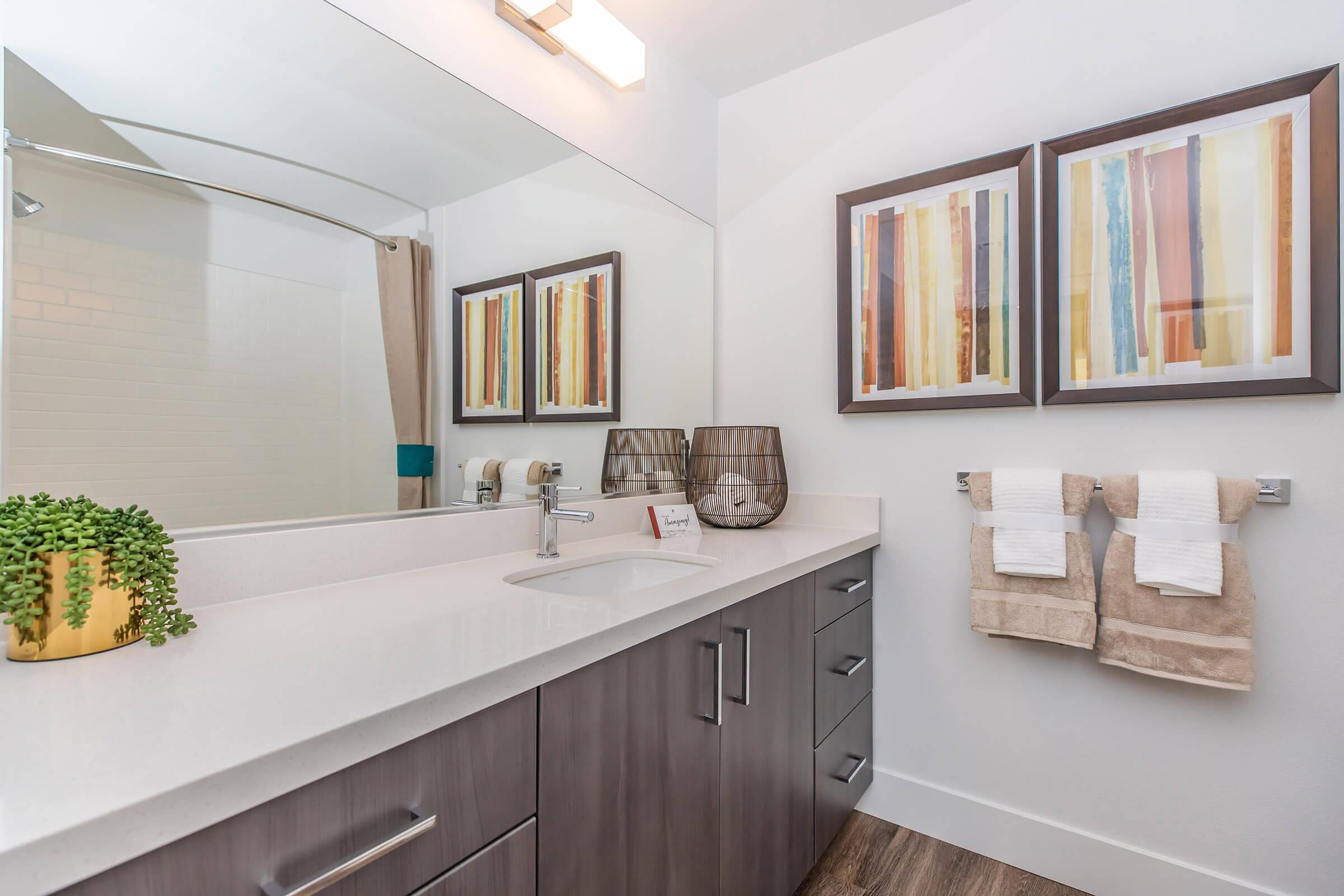 a room with a sink and a mirror
