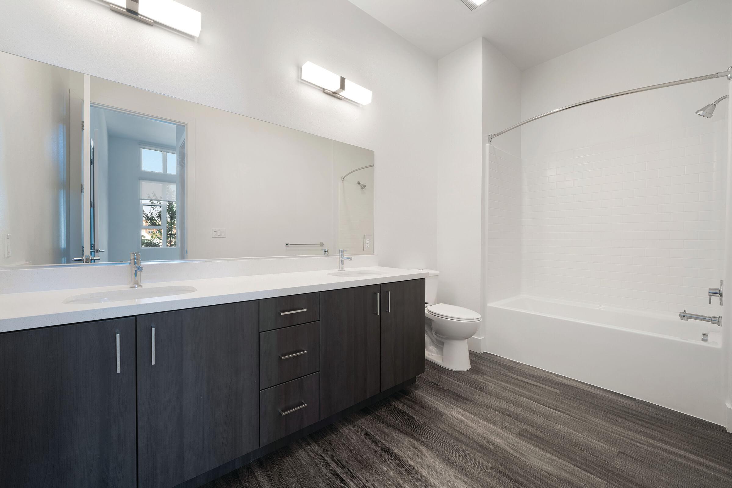 Bathroom with black cabinets
