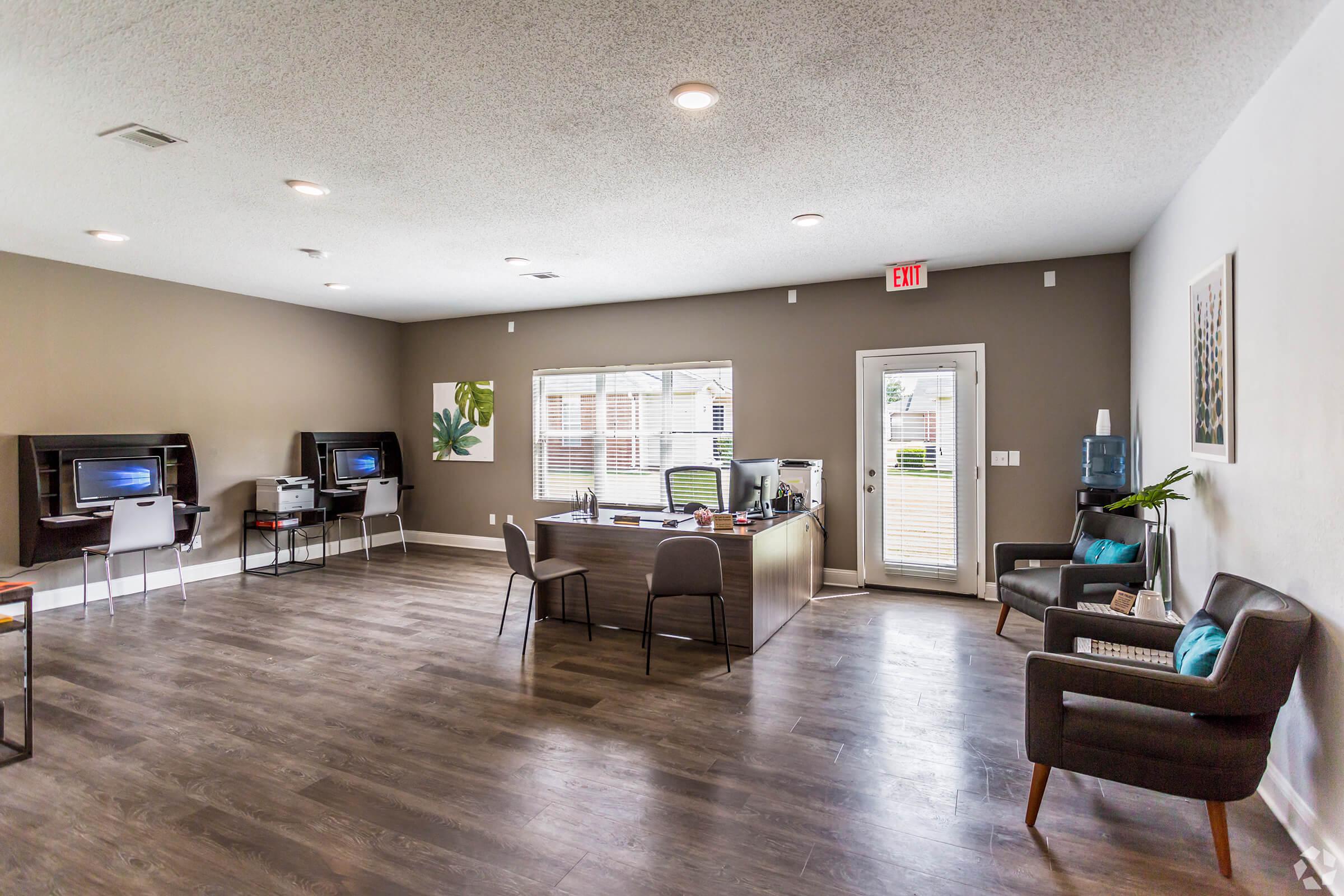 a living room filled with furniture and a flat screen tv