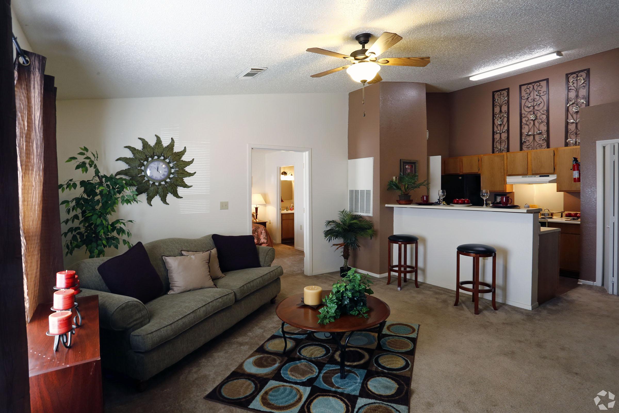 a living room filled with furniture and decor