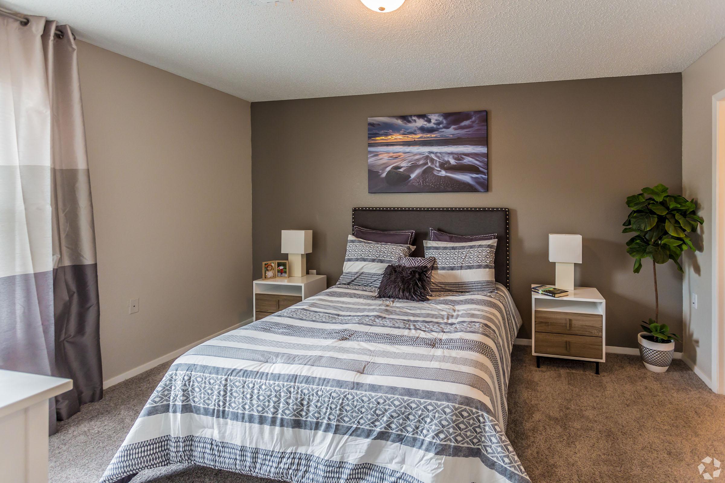 a bedroom with a bed in a hotel room