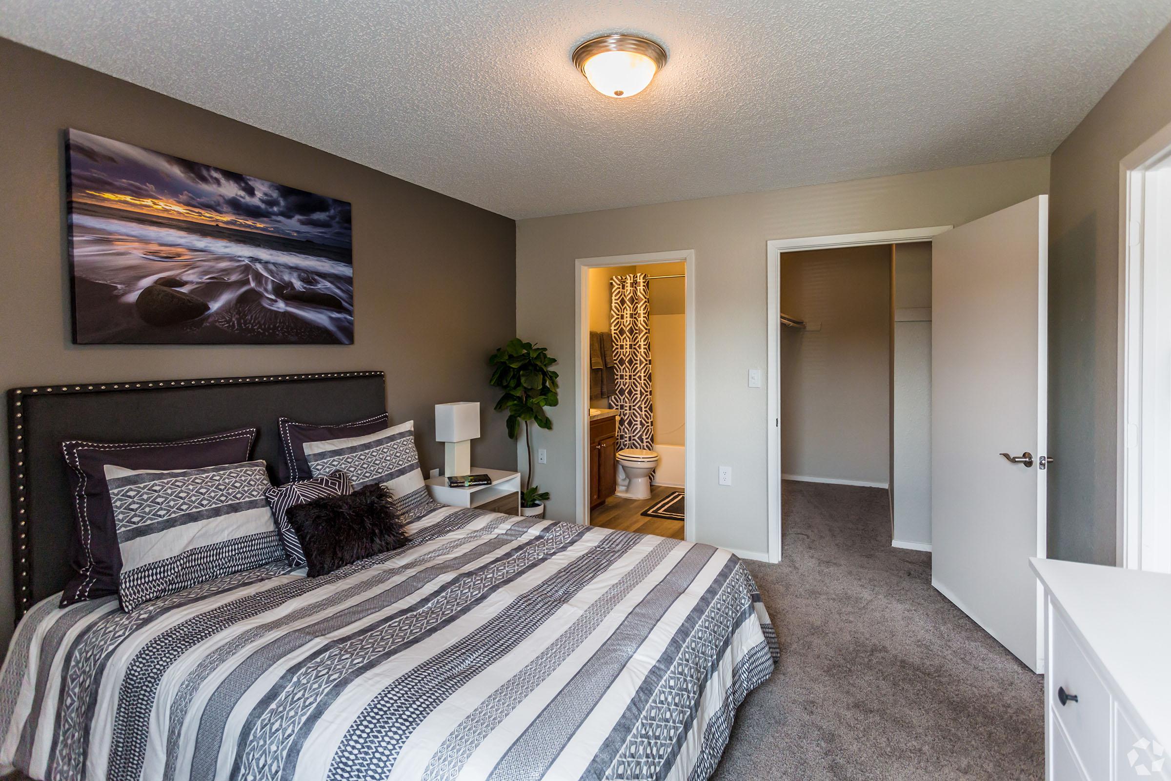 a bedroom with a large bed in a room