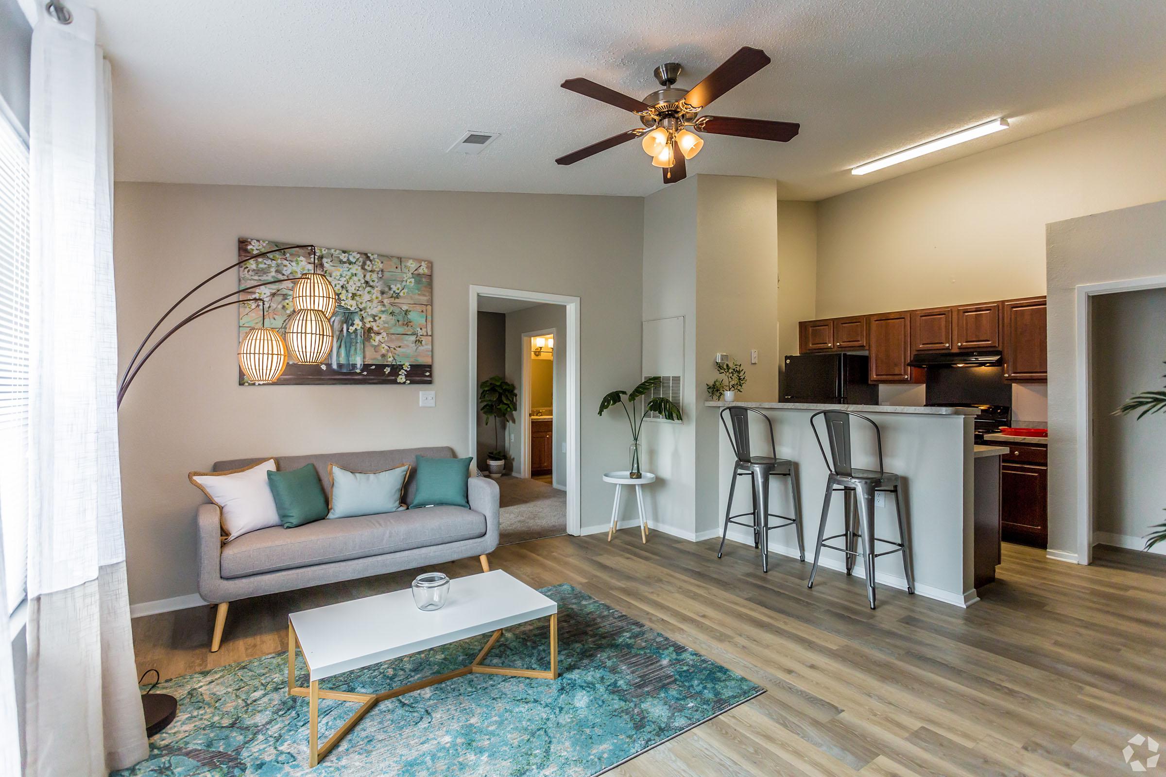 a living room filled with furniture and a fireplace