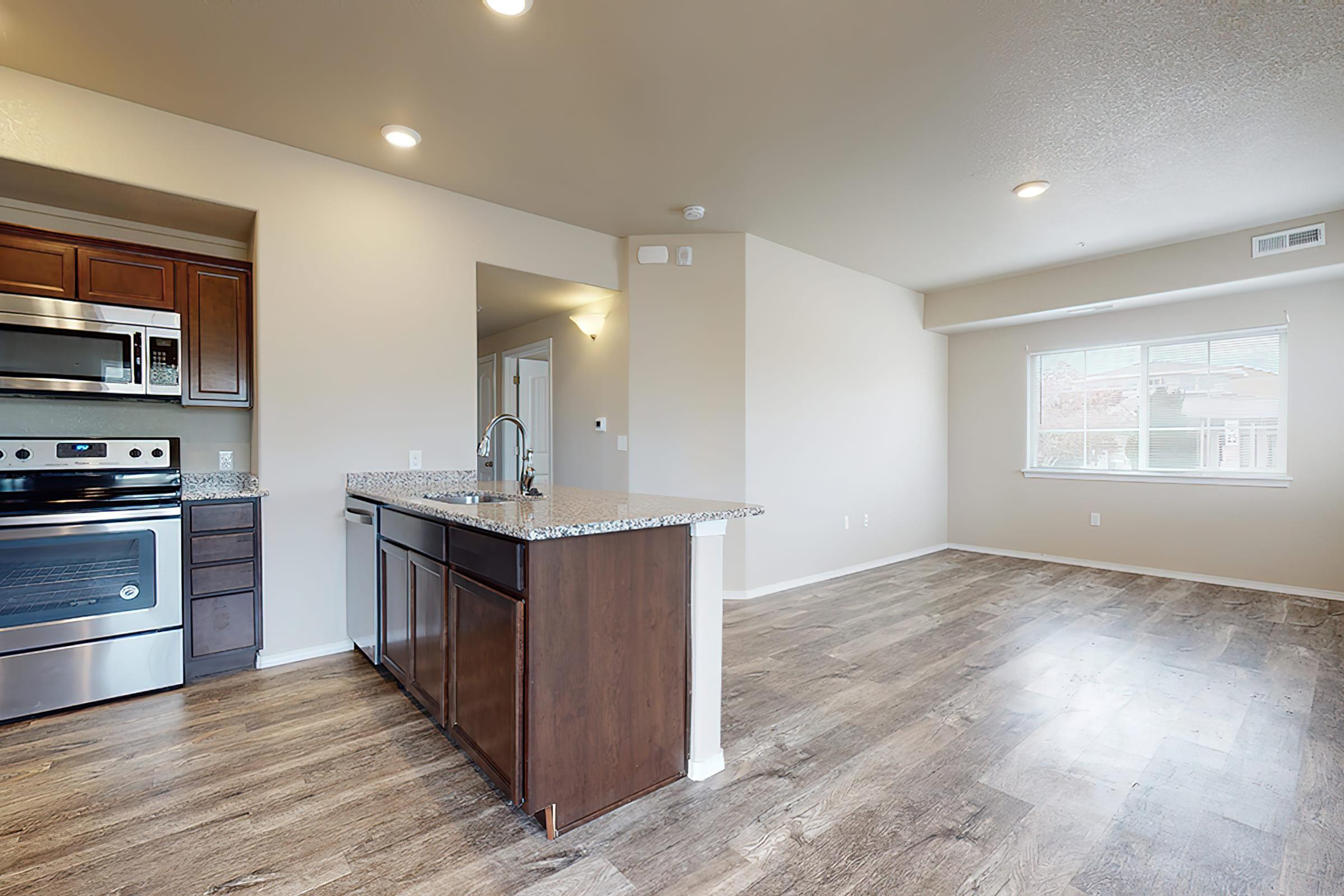 a kitchen with a wood floor