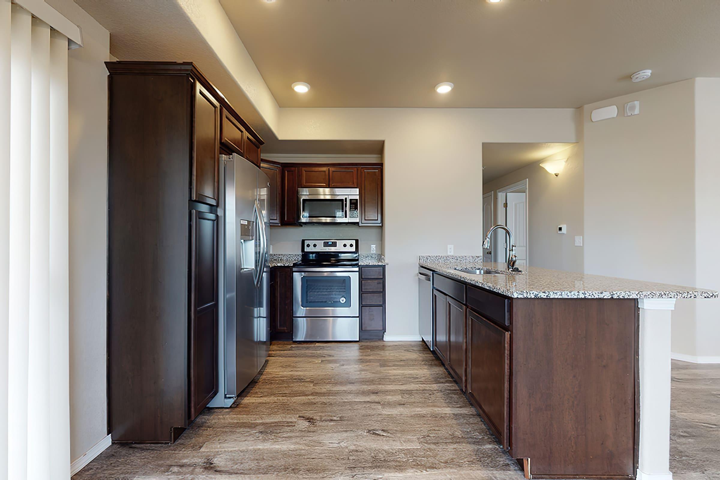 a kitchen with a wood floor