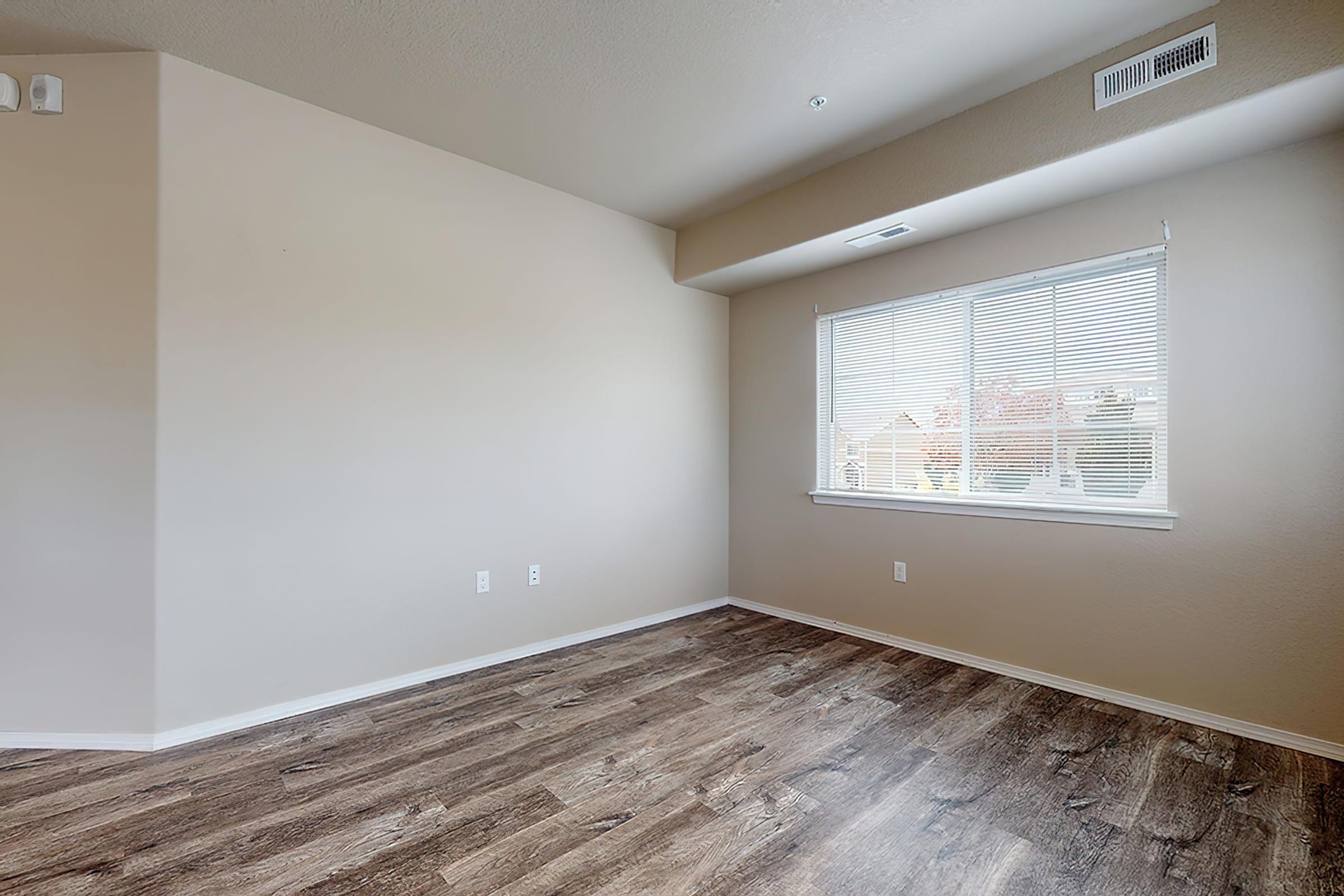 a bedroom with a large window