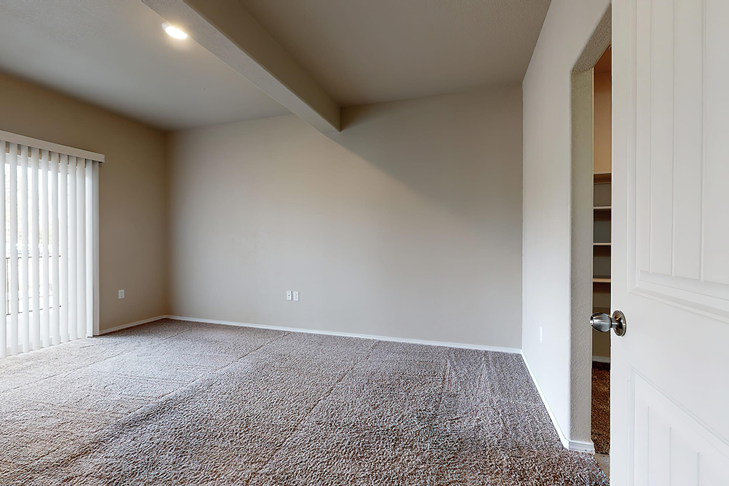 a bedroom with a large window