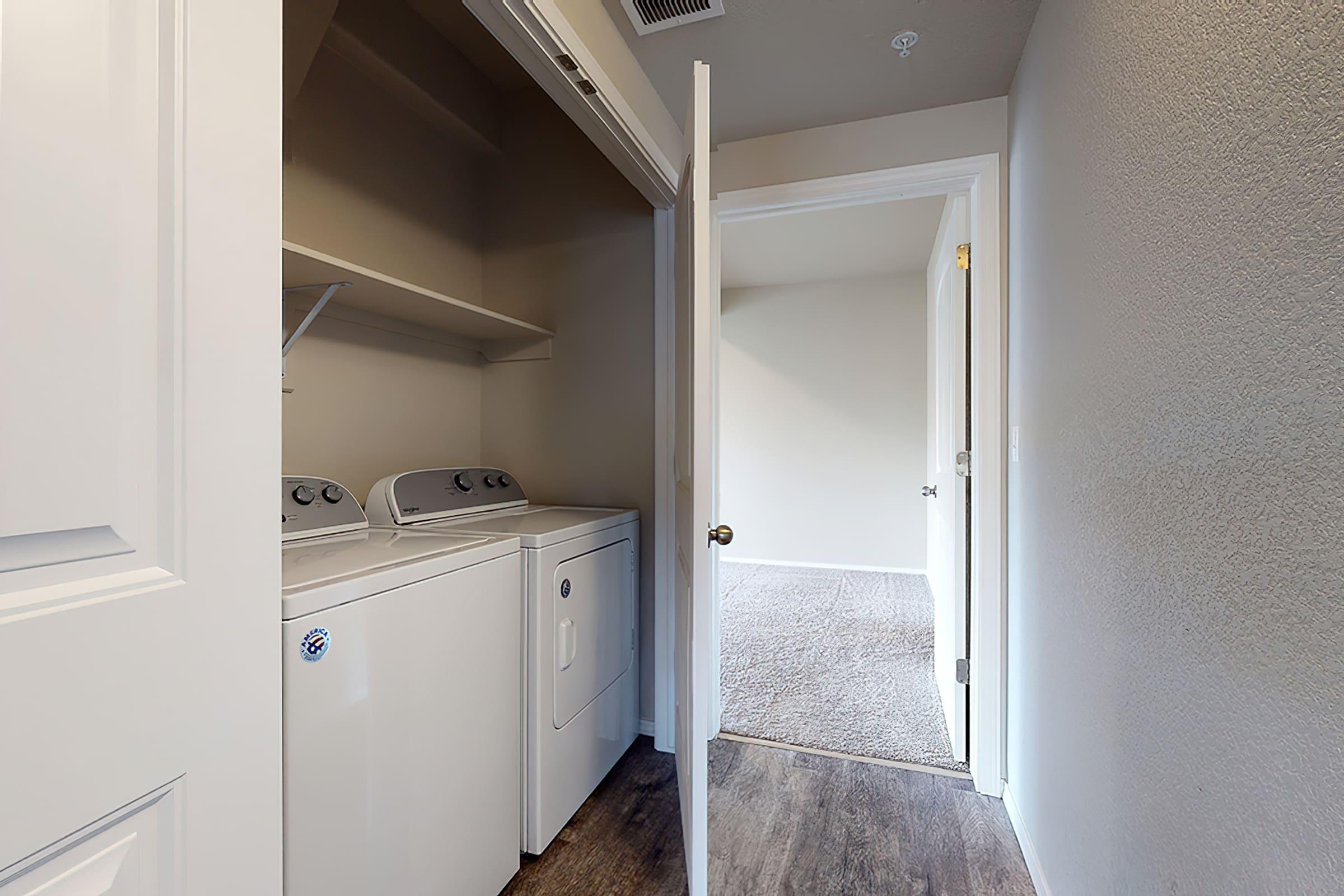 a kitchen with a sink and a refrigerator