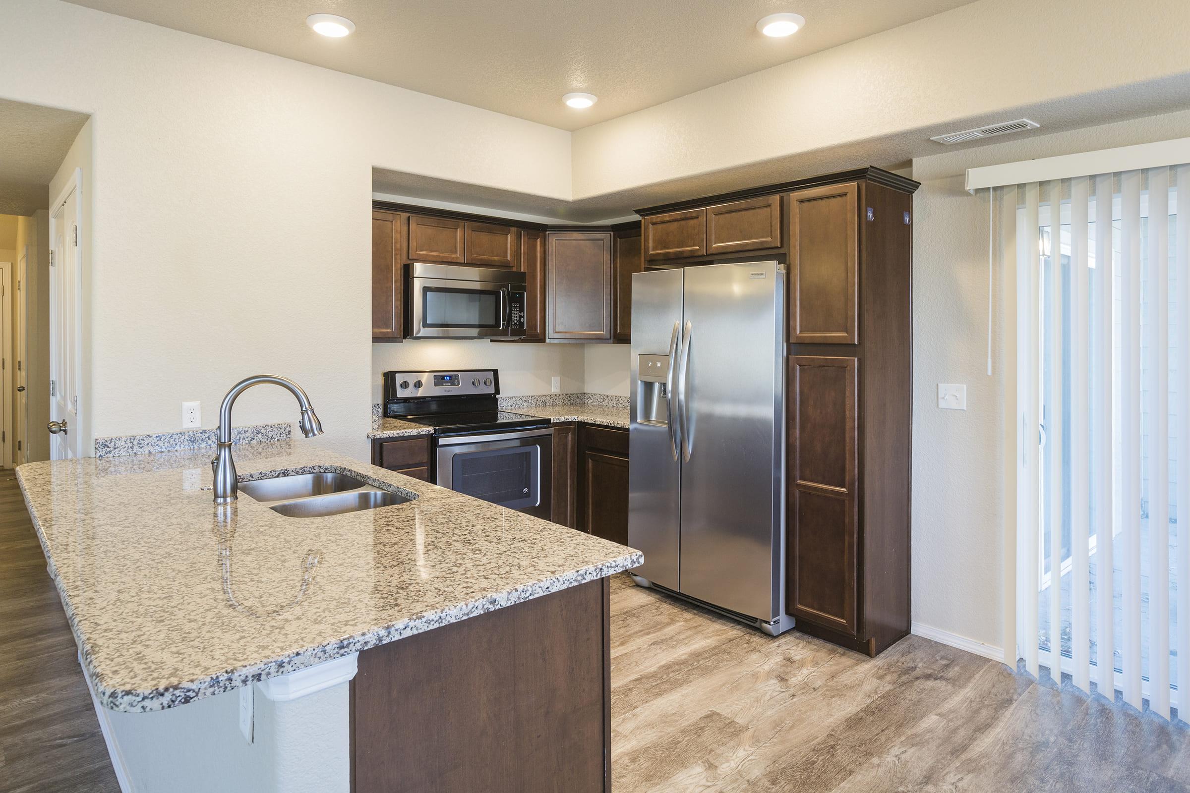 a modern kitchen with stainless steel appliances